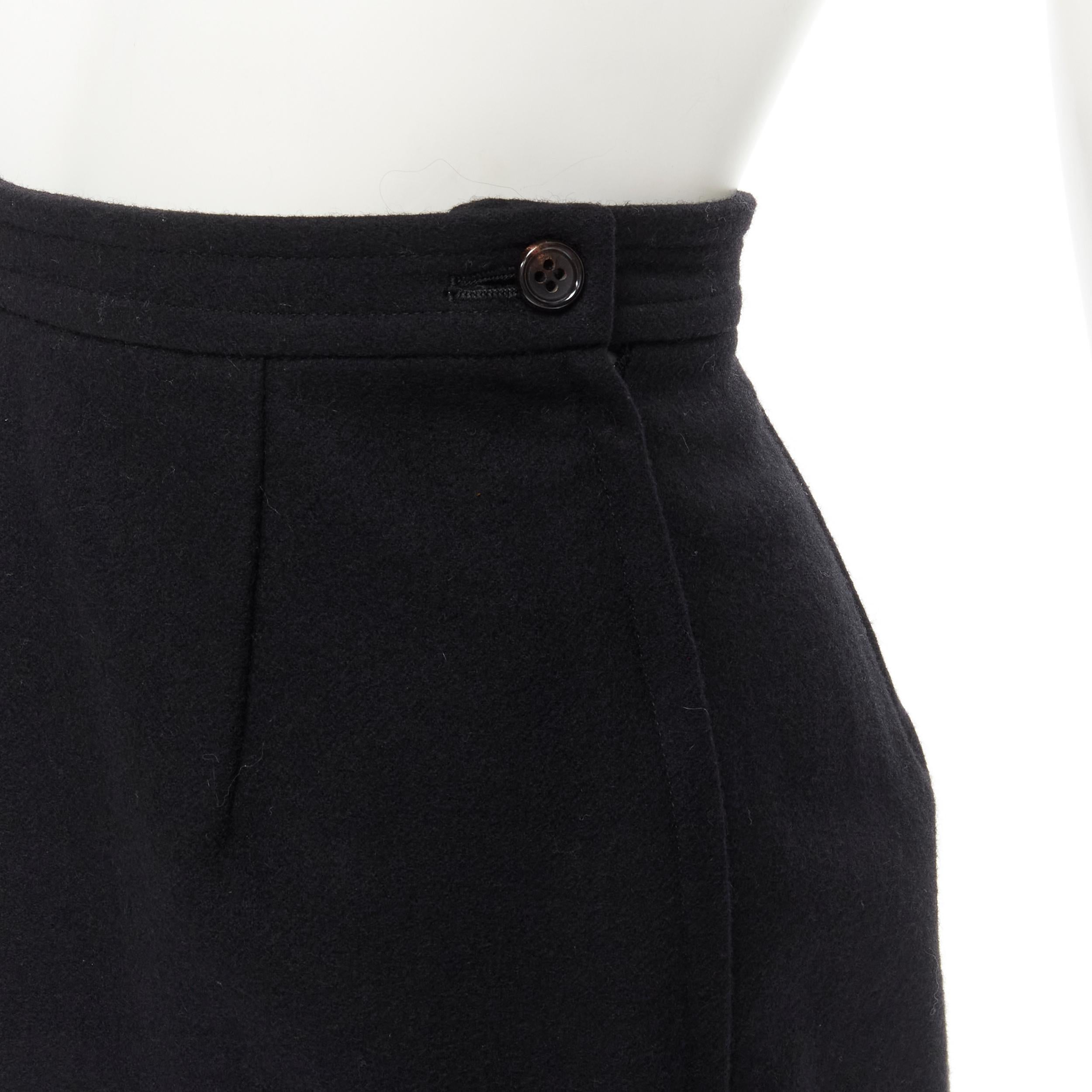 COMME DES GARCONS 1980s Vintage black wool felt asymmetric A-line flared skirt S 
Reference: CRTI/A00635 
Brand: Comme Des Garcons 
Designer: Rei Kawakubo 
Collection: 1980s 
Material: Wool 
Color: Black 
Pattern: Solid 
Closure: Zip 
Extra Detail: