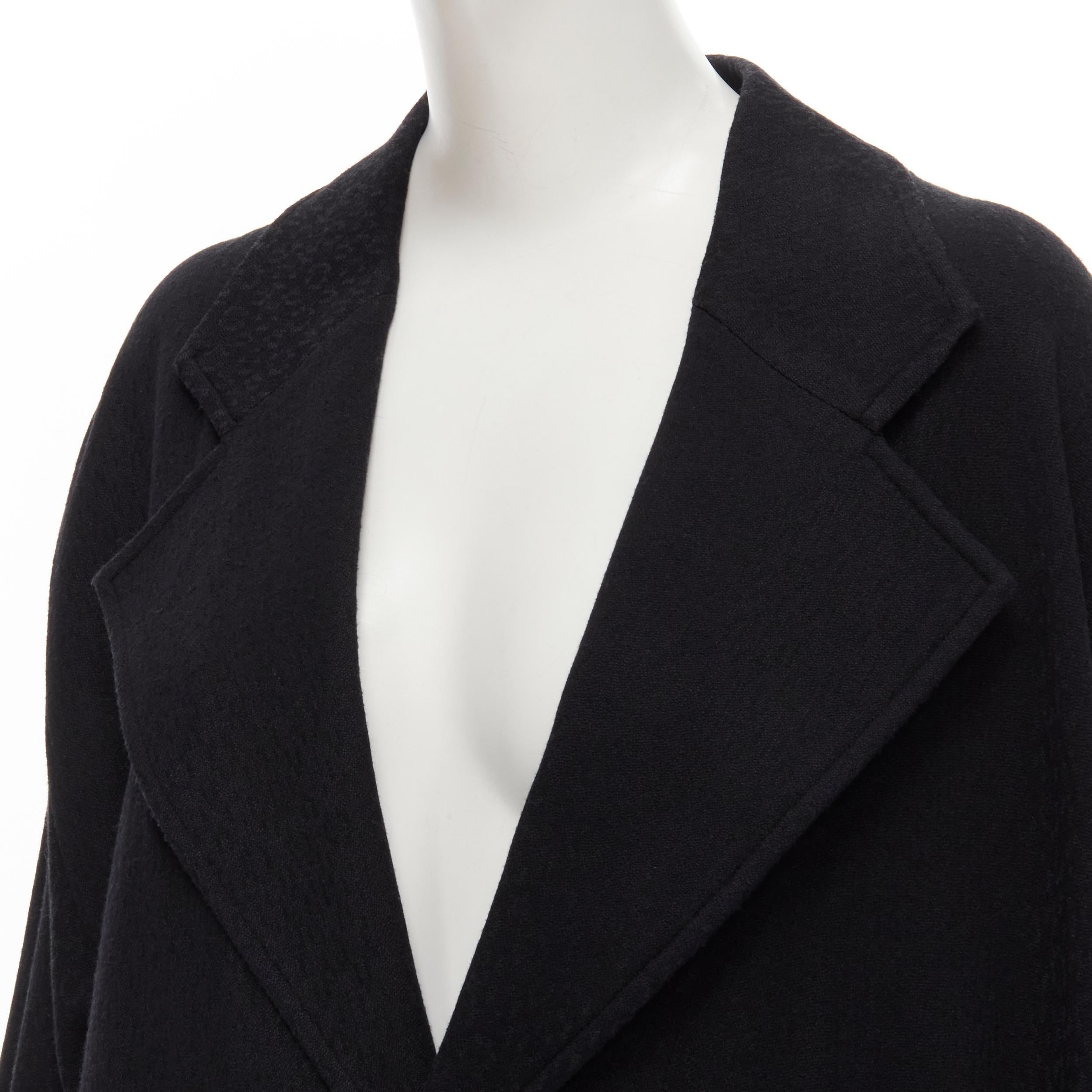 COMME DES GARCONS 1980's Vintage black wool wide cut oversized asymmetric blazer 
Reference: CRTI/A00684 
Brand: Comme Des Garcons 
Designer: Rei Kawakubo 
Collection: 1980s 
Material: Wool 
Color: Black 
Pattern: Solid 
Closure: Button Extra