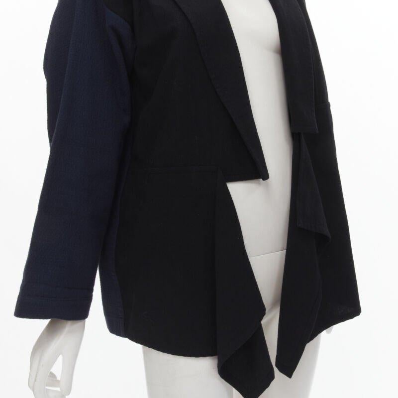 COMME DES GARCONS 1980's Vintage deconstructed black navy drape front blazer M
Reference: CRTI/A00670
Brand: Comme Des Garcons
Designer: Rei Kawakubo
Collection: 1980s
Material: Cotton, Wool
Color: Blue, Black
Pattern: Solid
Extra Details: Contrast