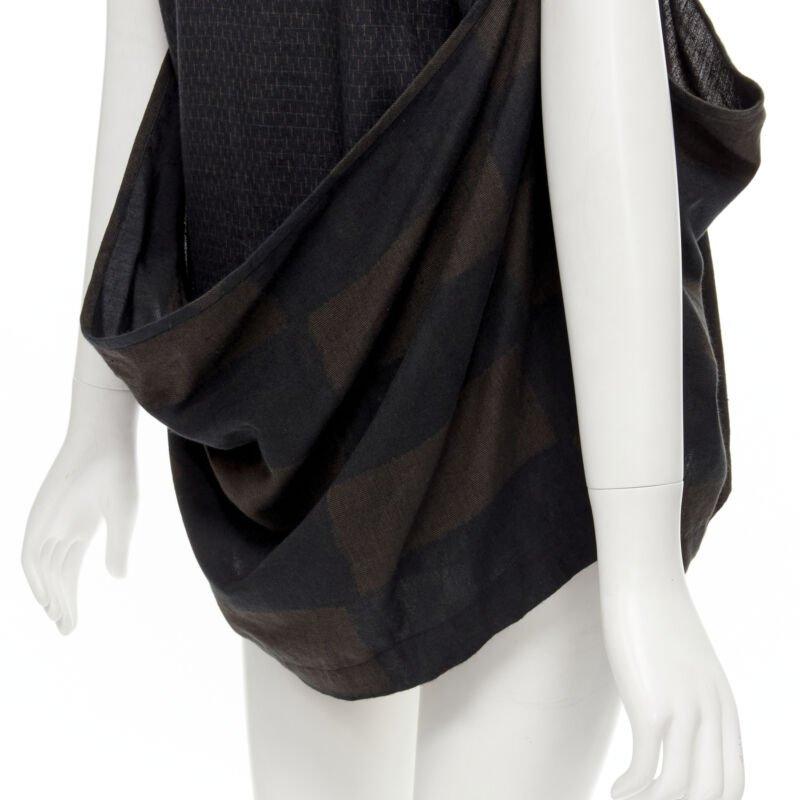 COMME DES GARCONS 1980's Vintage green checked wrap front draped vest top S
Reference: CRTI/A00668
Brand: Comme Des Garcons
Designer: Rei Kawakubo
Material: Feels like cotton
Color: Green, Brown
Pattern: Checkered
Extra Details: Wrap front draped
