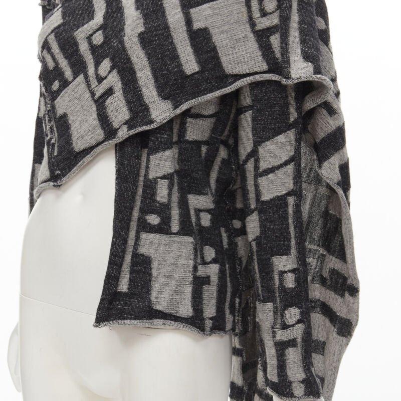 COMME DES GARCONS 1980's Vintage grey abstract wool intarsia wrap scarf cardigan
Reference: CRTI/A00672
Brand: Comme Des Garcons
Designer: Rei Kawakubo
Collection: 1980s
Material: Wool
Color: Grey
Pattern: Checkered
Extra Details: Attached wrap