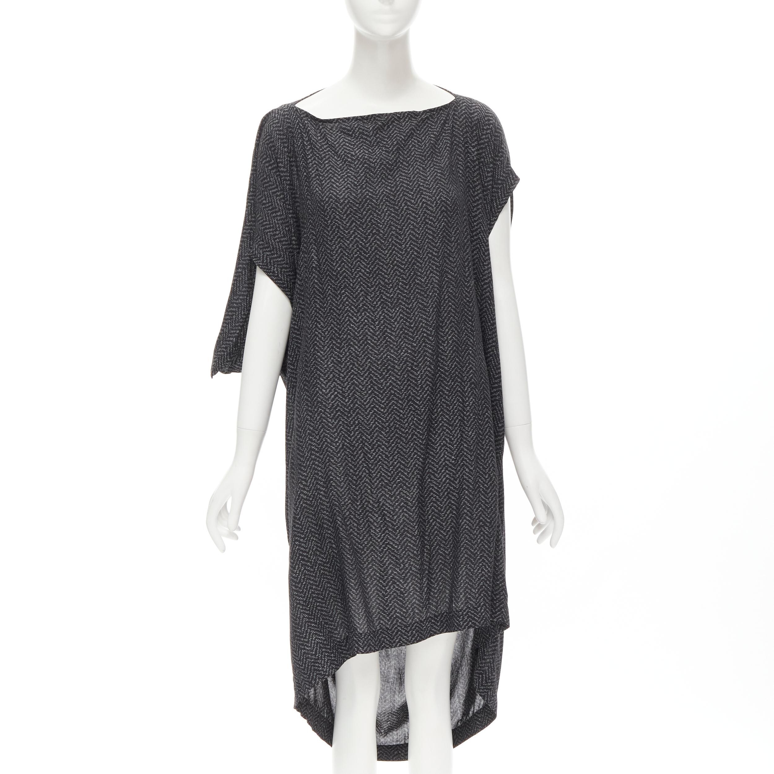 COMME DES GARCONS 1980's Vintage grey chevron asymmetric draped cocoon dress 
Reference: CRTI/A00677 
Brand: Comme Des Garcons 
Designer: Rei Kawakubo 
Collection: 1980s 
Color: Grey 
Pattern: Chevron 
Extra Detail: Boat neck. Asymmetric sleeves.