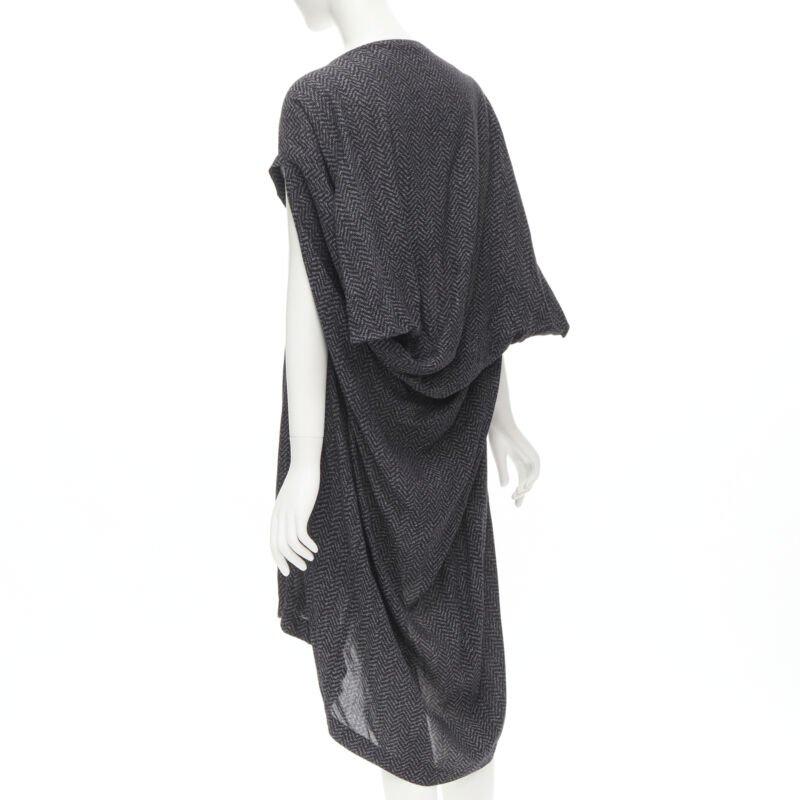 COMME DES GARCONS 1980's Vintage grey chevron asymmetric draped cocoon dress
Reference: CRTI/A00677
Brand: Comme Des Garcons
Designer: Rei Kawakubo
Collection: 1980s
Color: Grey
Pattern: Chevron
Extra Details: Boat neck. Asymmetric sleeves. Draped