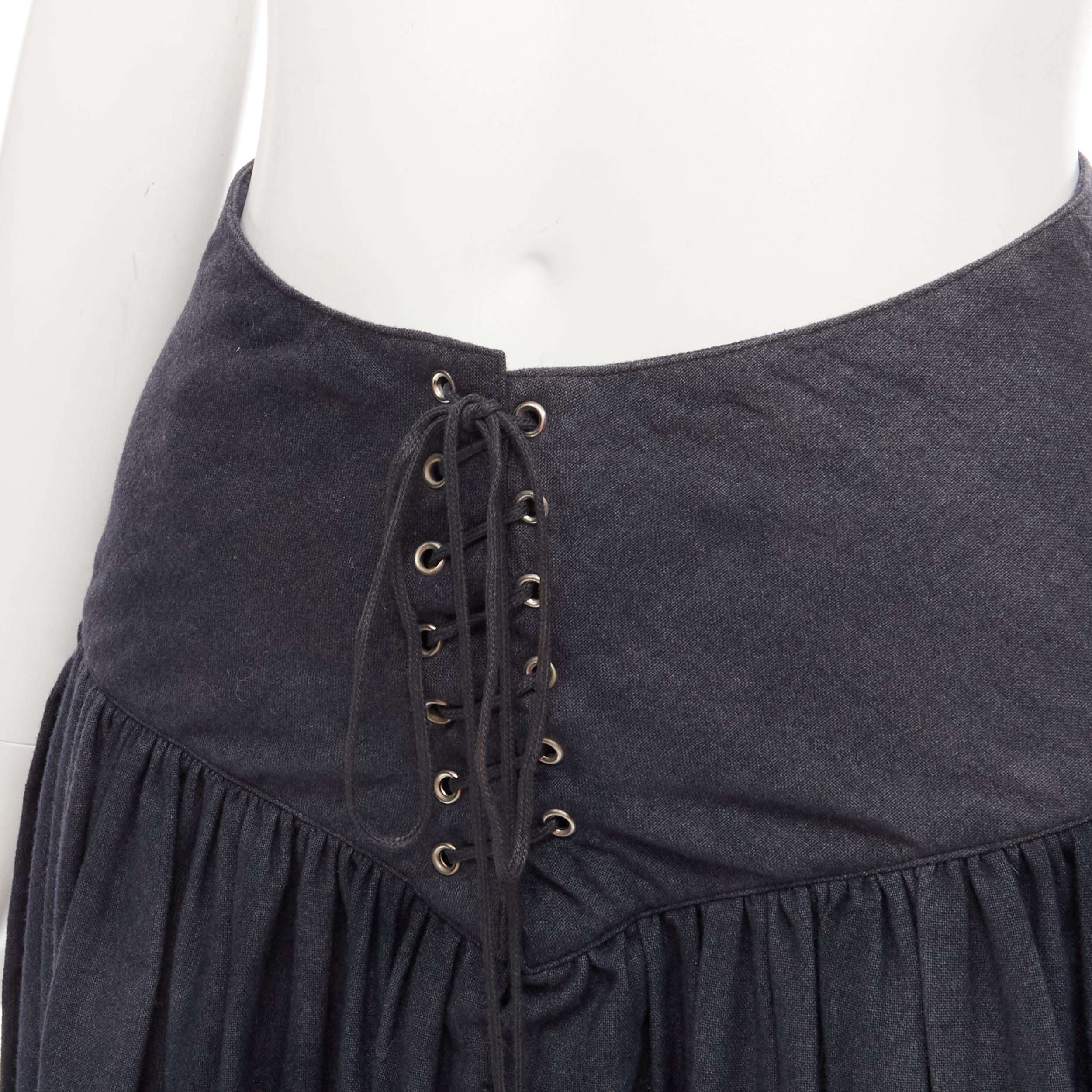 COMME DES GARCONS 1980's Vintage grey wool corset lace tiered flared skirt S 
Reference: CRTI/A00713 
Brand: Comme Des Garcons 
Designer: Rei Kawakubo 
Collection: 1980s 
Material: Wool 
Color: Grey 
Pattern: Solid 
Closure: Laced 
Extra Detail: