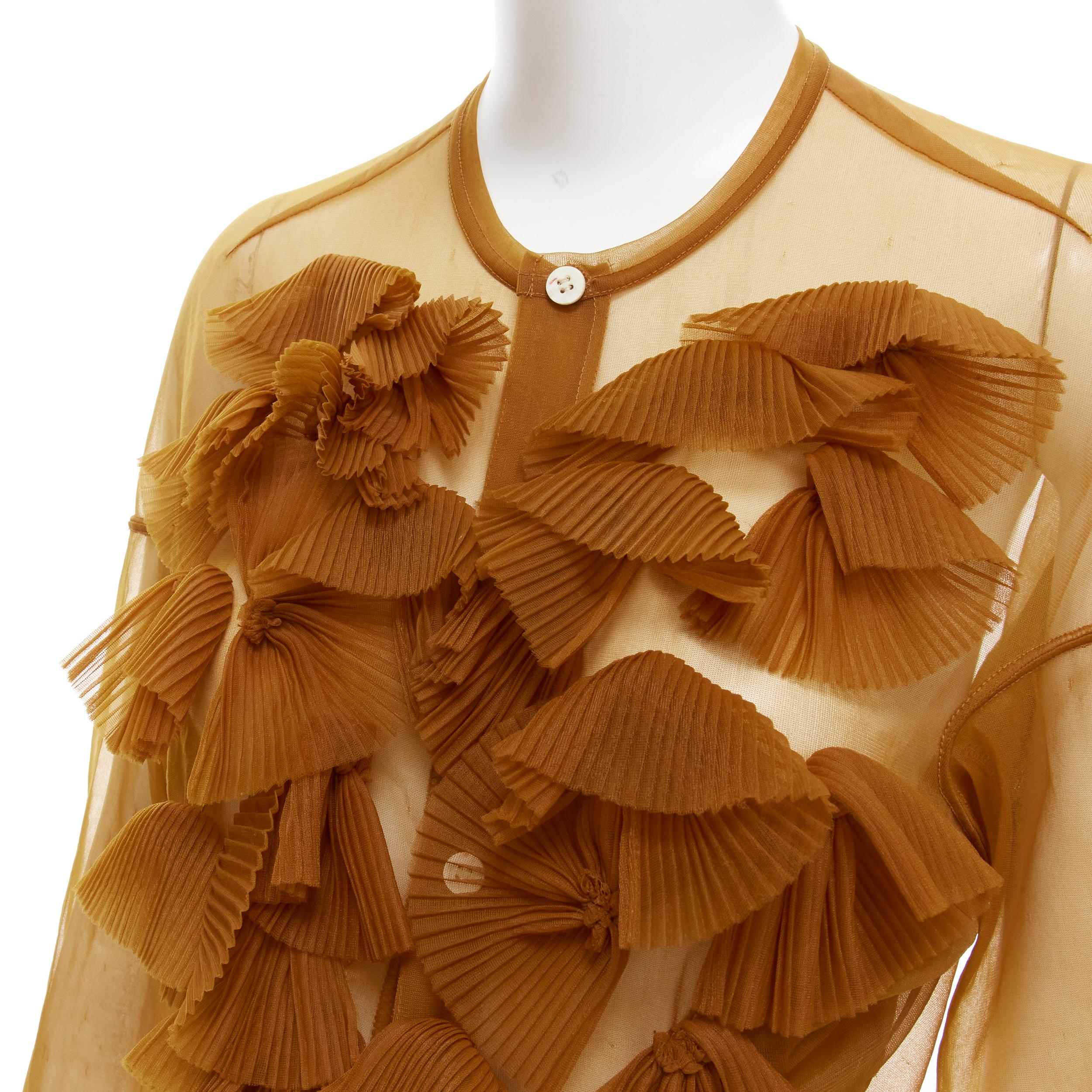 COMME DES GARCONS 1990s sheer brown pleated ruffle button front long sleeve shirt M 
Reference: CRTI/A00518 
Brand: Comme Des Garcons 
Material: Rayon 
Color: Brown 
Pattern: Solid 
Closure: Button 
Extra Detail: Button front. Pleated ruffle front.