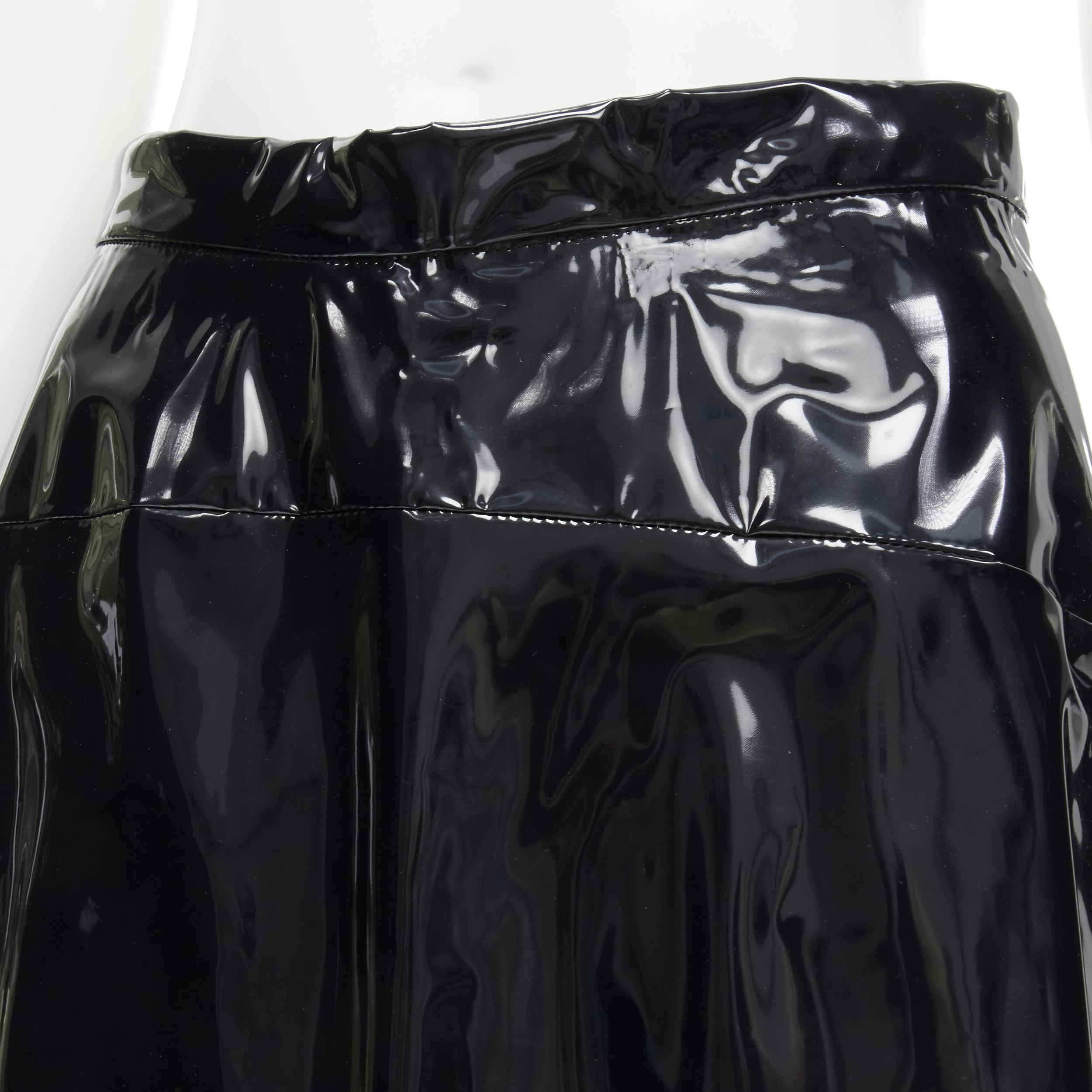 COMME DES GARCONS 1991 black vinyl plastic bias cut A-lined flared skirt L
Reference: CRTI/A00509
Brand: Comme Des Garcons
Collection: 1991 
Material: Plastic
Color: Black
Pattern: Solid
Closure: Zip
Extra Detail: Button zip closure. Bias cut. Knee