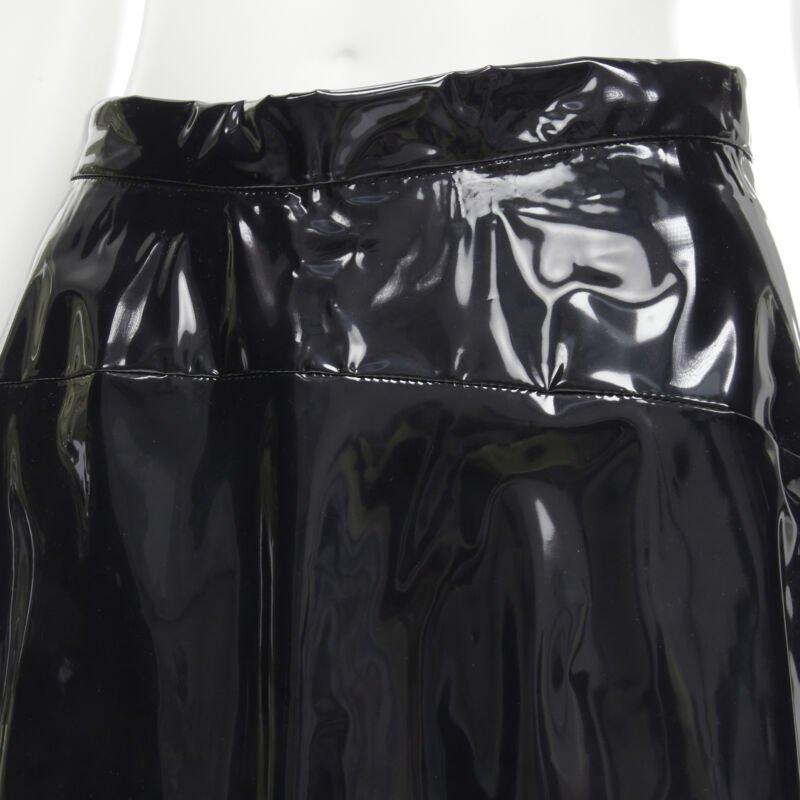 COMME DES GARCONS 1991 black vinyl plastic bias cut A-lined flared skirt L
Reference: CRTI/A00509
Brand: Comme Des Garcons
Designer: Rei Kawakubo
Collection: 1991
Material: Plastic
Color: Black
Pattern: Solid
Closure: Zip
Lining:  Polyester
Extra