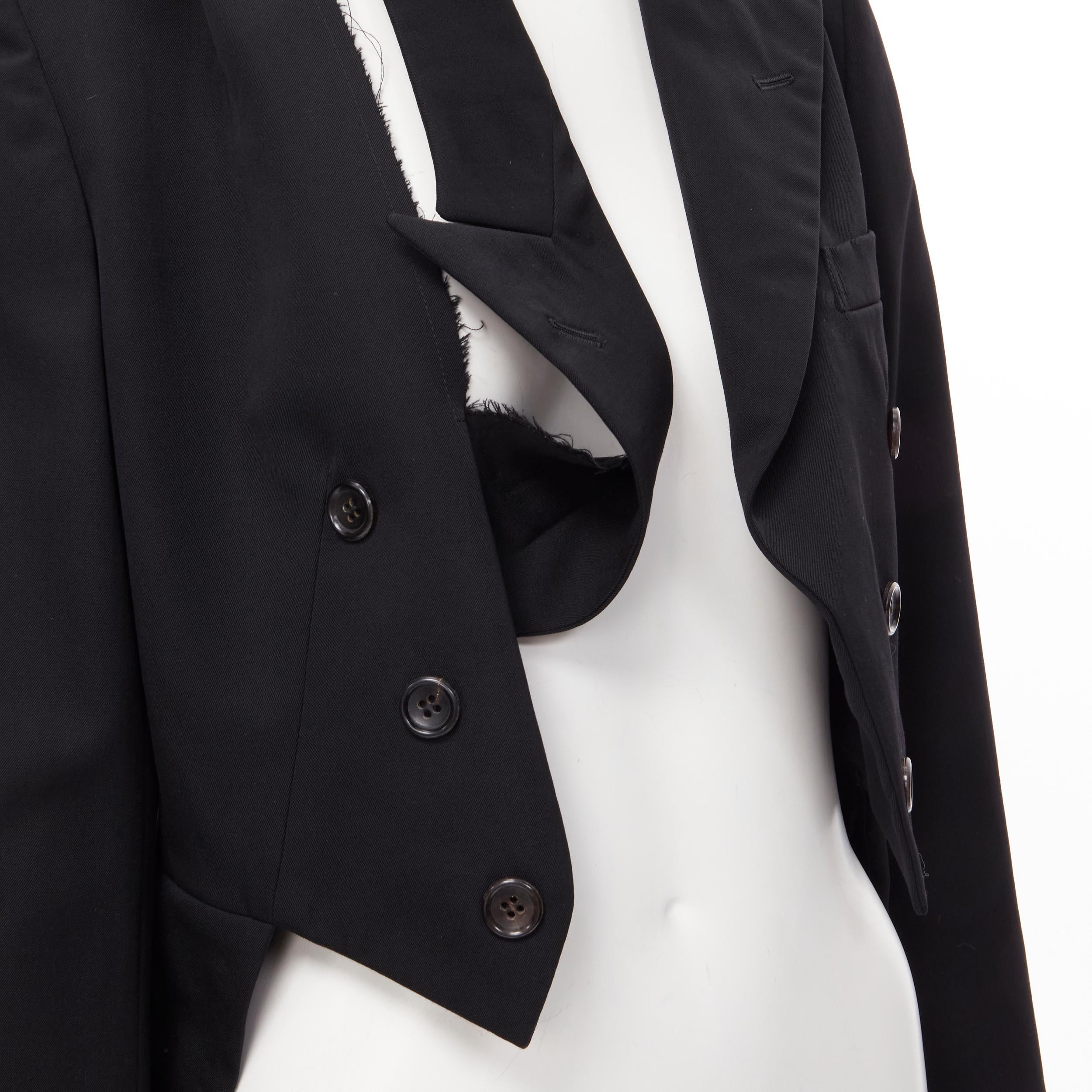 COMME DES GARCONS 1991 black wool deconstructed collar double breasted blazer S 
Reference: CRTI/A00443 
Brand: Comme Des Garcons 
Collection: 1991 
Material: Wool 
Color: Black 
Pattern: Solid 
Extra Detail: Decorative button. Deconstructed draped