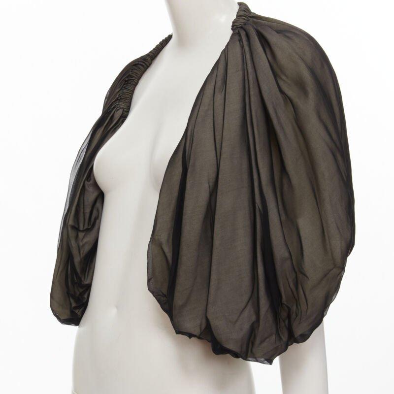 COMME DES GARCONS 1993 Vintage black voluminous shrug Cindy Sherman
Reference: CRTI/A00714
Brand: Comme Des Garcons
Designer: Rei Kawakubo
Collection: 1993 - Runway
As seen on: Cindy Sherman
Material: Polyester, Linen
Color: Black
Pattern: