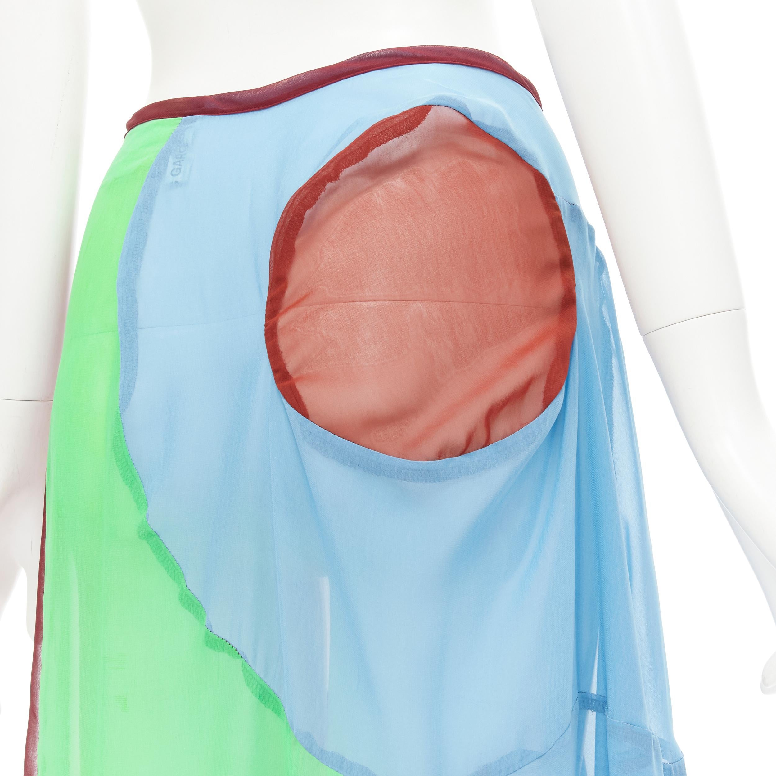 COMME DES GARCONS 1995 Runway Vintage curved seam optical color sheer skirt M 
Reference: CRTI/A00612 
Brand: Comme Des Garcons 
Designer: Rei Kawakubo 
Collection: 19995 Runway 
Material: Polyester 
Color: Multicolour 
Pattern: Solid 
Closure: Zip