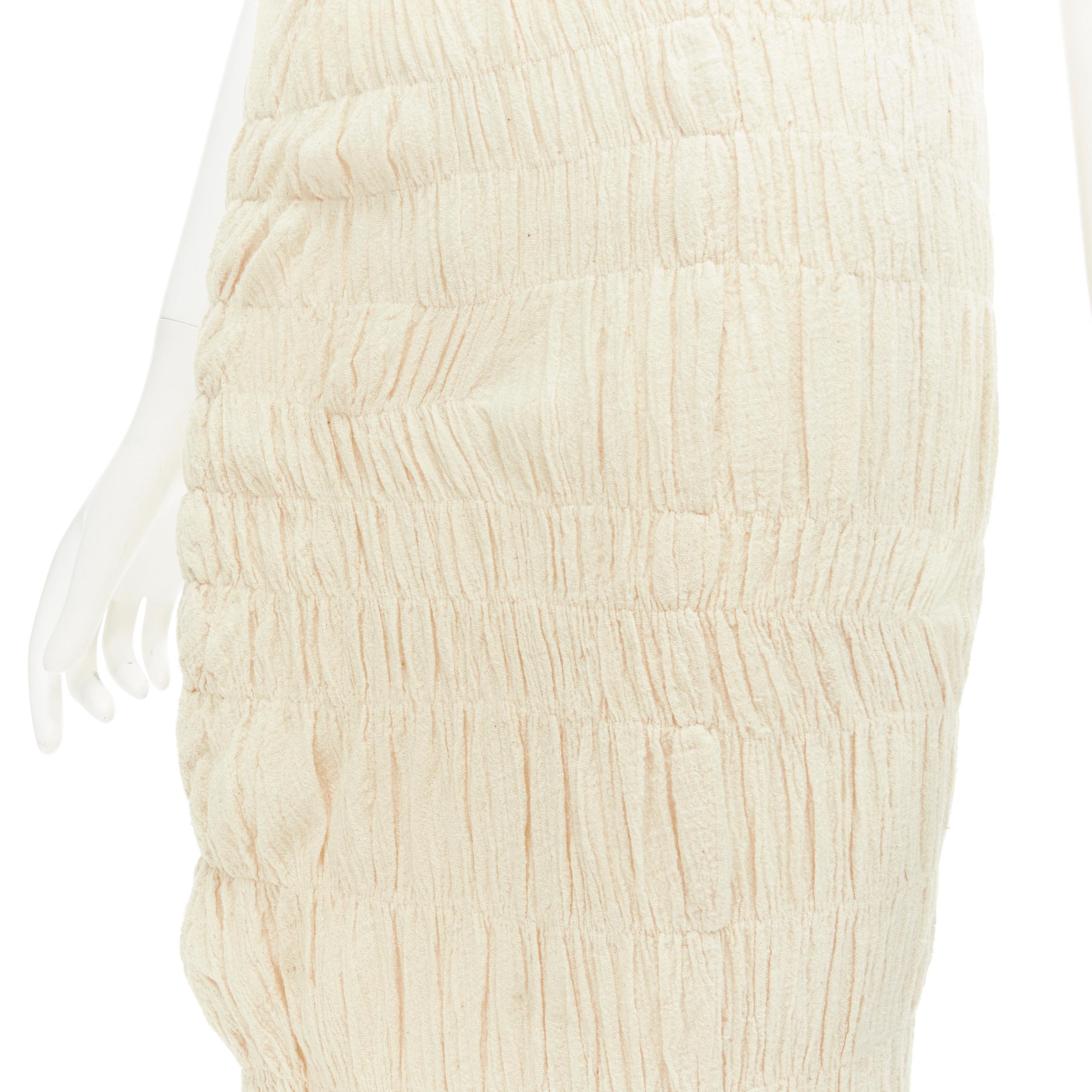 COMME DES GARCONS 1996 Vintage beige shirred Lump Bumps midi skirt S 
Reference: CRTI/A00644 
Brand: Comme Des Garcons 
Designer: Rei Kawakubo 
Collection: 1996 
Material: Cotton 
Color: Beige 
Pattern: Solid 
Extra Detail: Irregular asymmetric bias