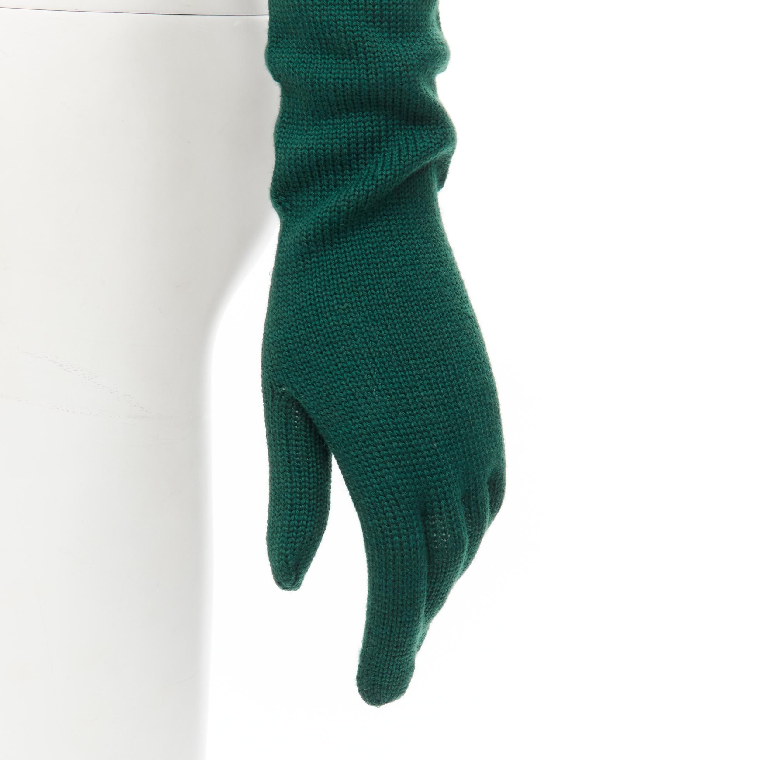 COMME DES GARCONS 1996 Vintage Runway green wool full opera gloves rare 
Reference: CRTI/A00718 
Brand: Comme Des Garcons 
Designer: Rei Kawakubo 
Collection: 1996 Runway 
Material: Wool 
Color: Green 
Pattern: Solid 
Extra Detail: Wool knit. Curled