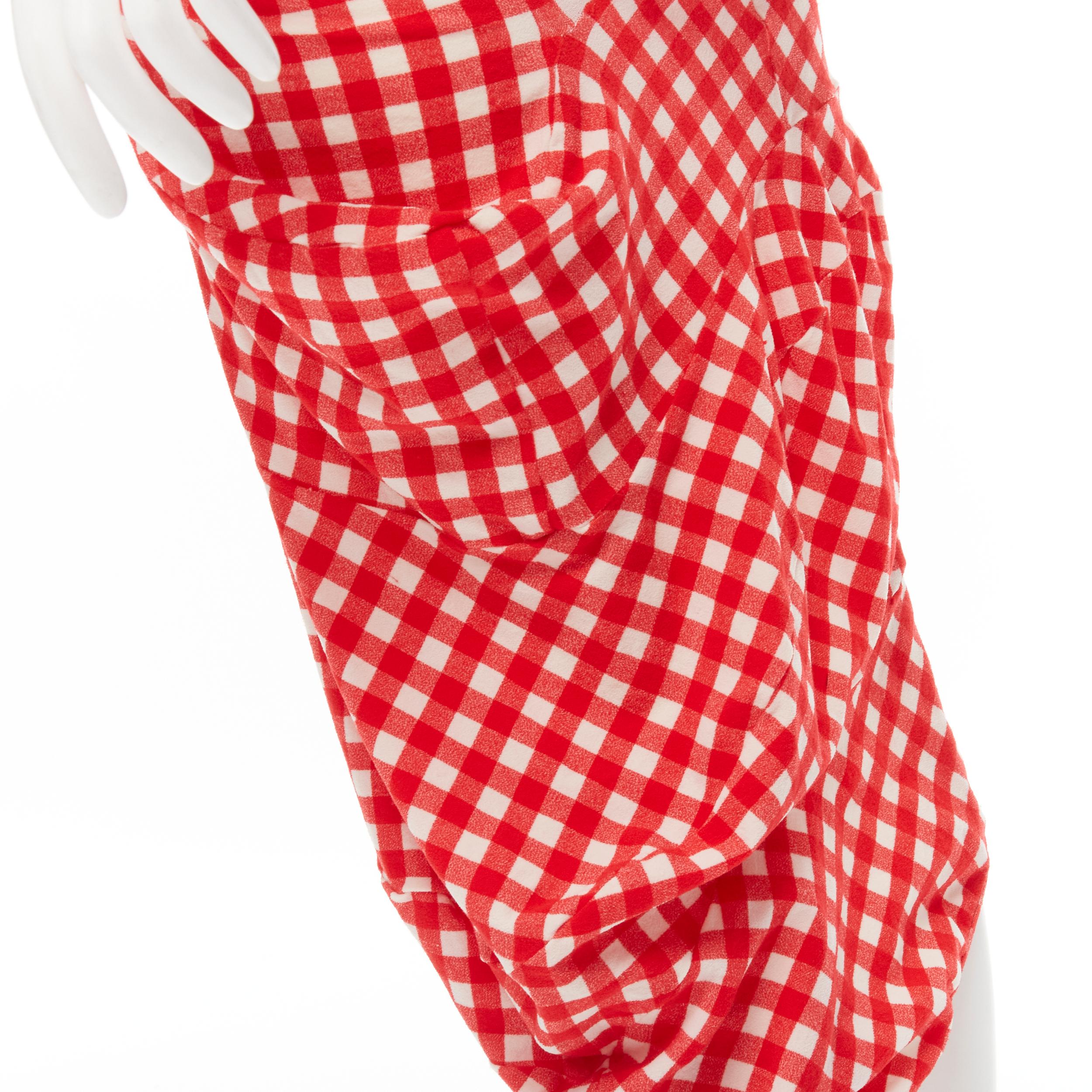 COMME DES GARCONS 1997 Vintage Lumps and Bumps red sheer top irregular skirt S 
Reference: CRTI/A00721 
Brand: Comme Des Garcons 
Designer: Rei Kawakubo 
Material: Viscose 
Color: Red 
Pattern: Gingham 
Extra Detail: Red sheer top with irregular