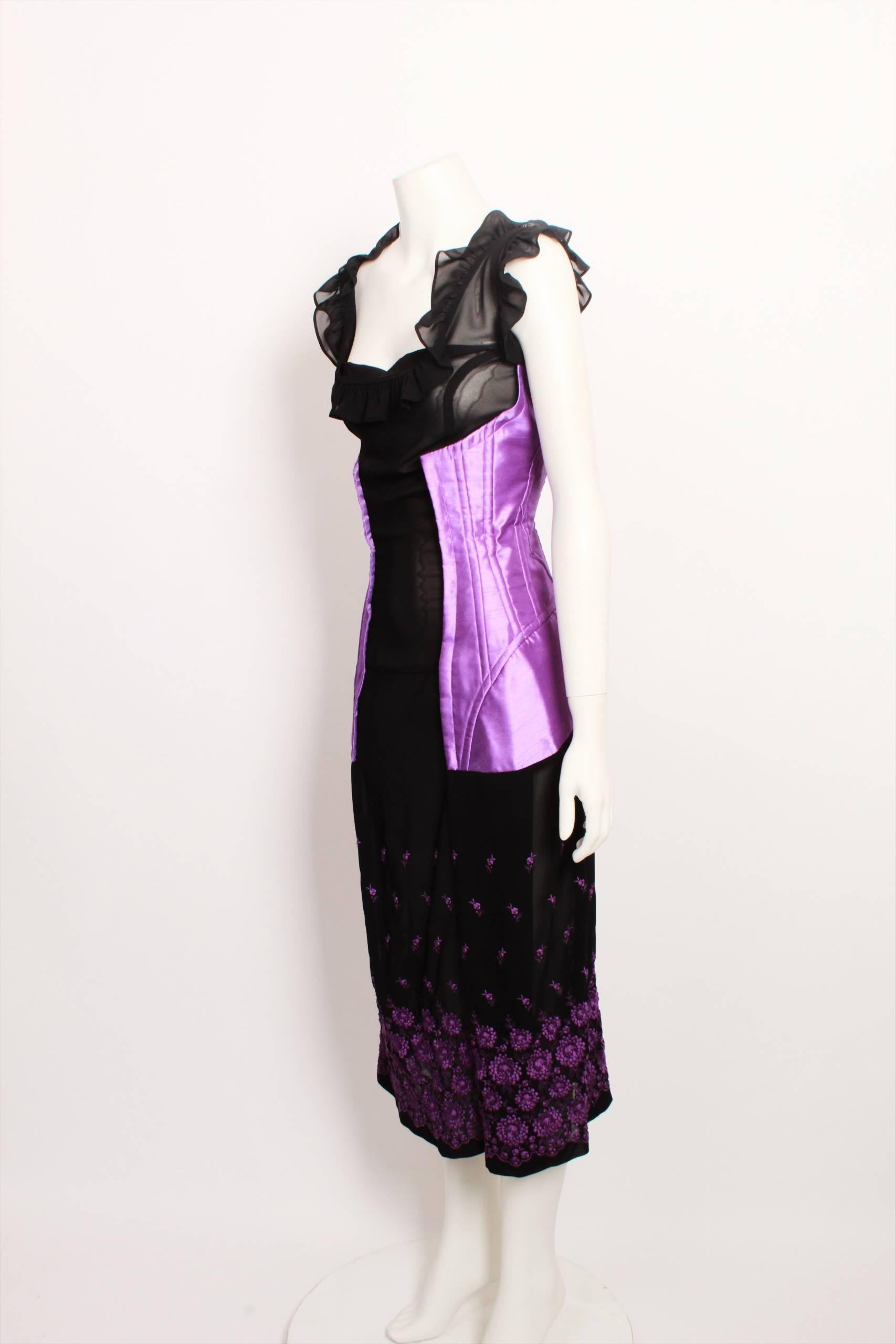 Comme des Garcons  2001 black dress with purple floral embroidered detail.
Made in Japan. Size M. 