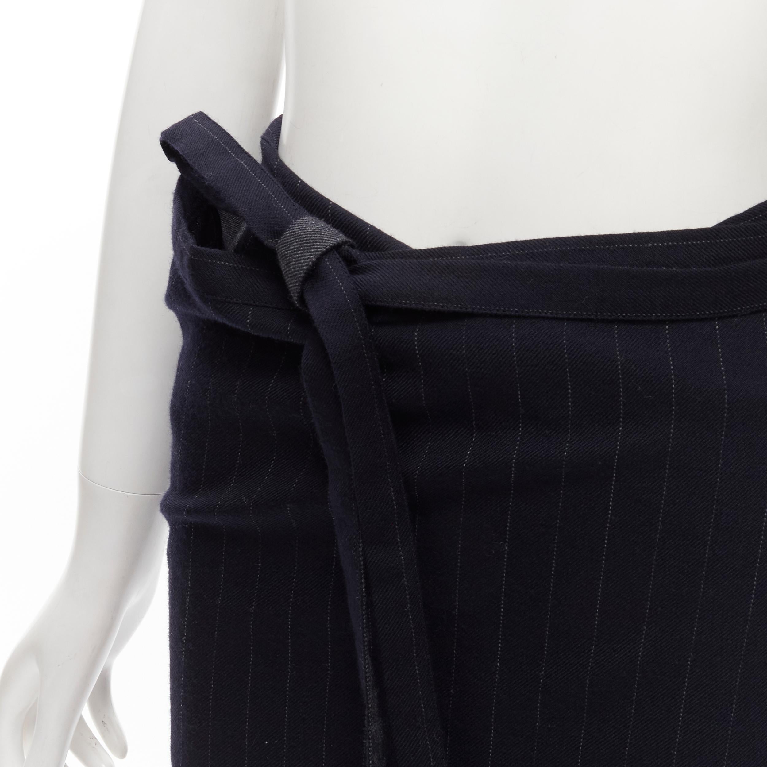 COMME DES GARCONS 2003 100% wool black pinstripe plaid bow wrap kilt skirt
Reference: TGAS/C01695
Brand: Comme Des Garcons
Designer: Rei Kawakubo
Material: Wool
Color: Black
Pattern: Pinstriped
Closure: Wrap Tie
Extra Details: Oversized plaid detail