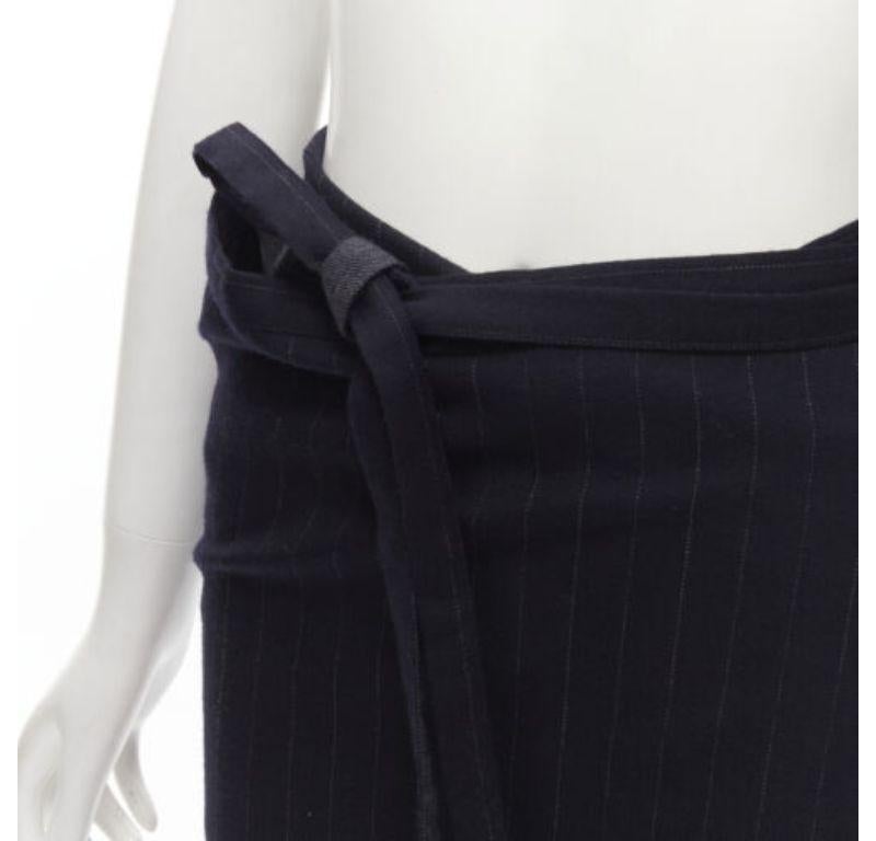 COMME DES GARCONS 2003 100% wool black pinstripe plaid bow wrap kilt skirt
Reference: TGAS/C01695
Brand: Comme Des Garcons
Designer: Rei Kawakubo
Material: Wool
Color: Black
Pattern: Pinstriped
Closure: Wrap Tie
Extra Details: Oversized plaid detail