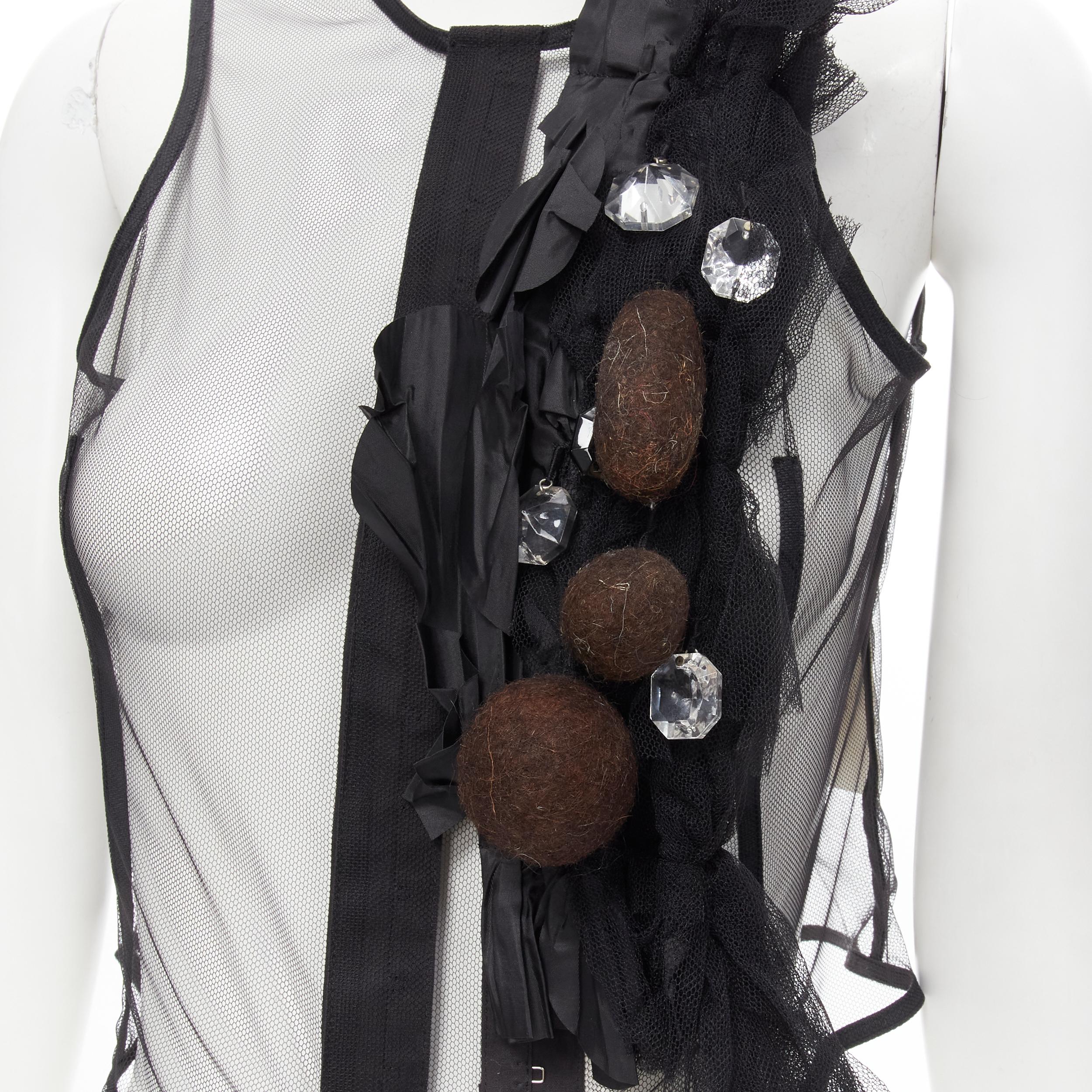 COMME DES GARCONS 2004 black sheer net mesh jewel embellishment ruffle vest S 
Reference: CRTI/A00475 
Brand: Comme Des Garcons 
Collection: 2004 
Material: Viscose 
Color: Black 
Pattern: Solid 
Closure: Hook & Eye 
Extra Detail: Hook and eye
