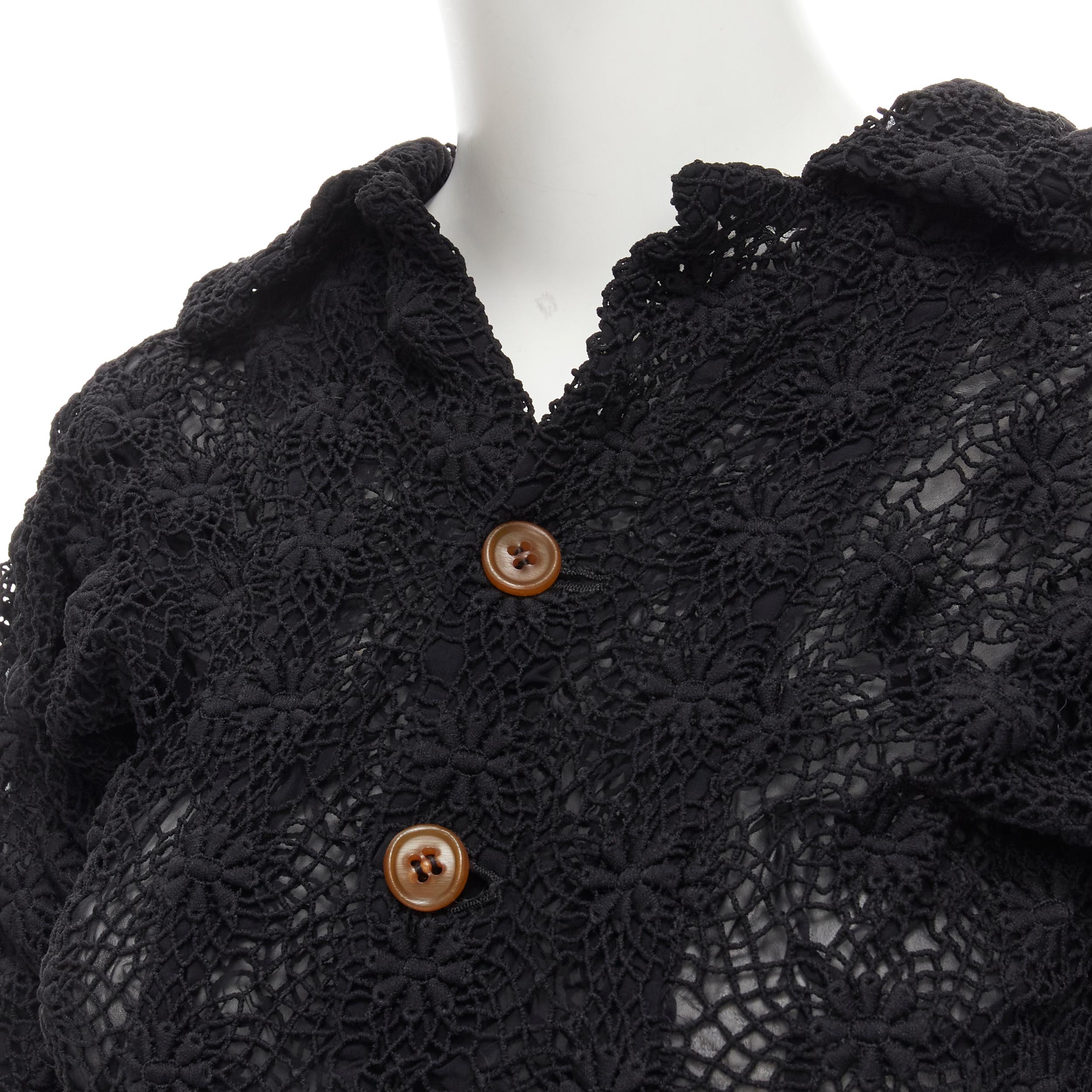 COMME DES GARCONS 2005 black floral crochet lace ruffle tiered hem jacket M 
Reference: CRTI/A00532 
Brand: Comme Des Garcons 
Designer: Rei Kawakubo 
Collection: 2005 
Material: Polyester 
Color: Black 
Pattern: Solid 
Closure: Button 
Extra