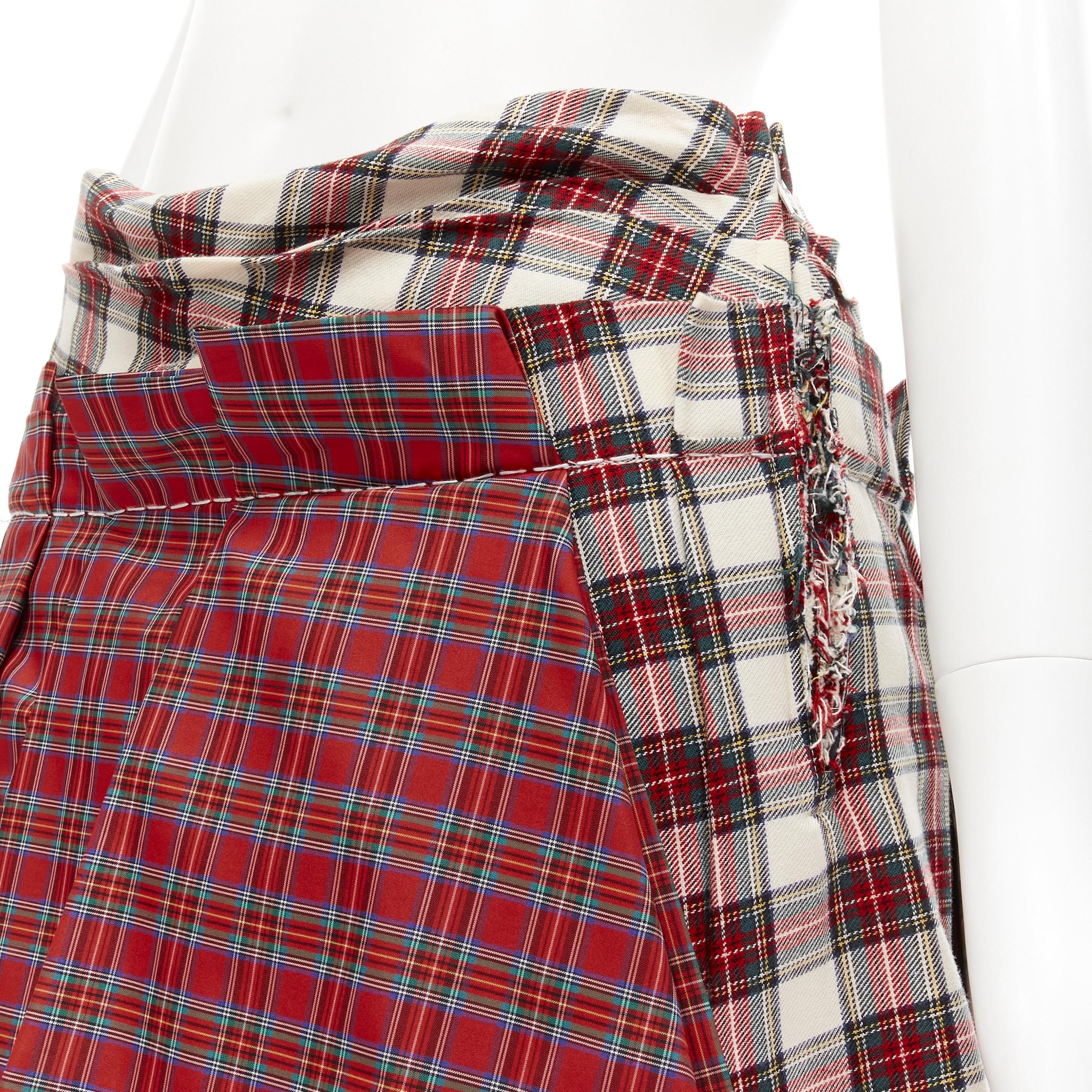 COMME DES GARCONS 2005 Runway Vintage plaid check cotton deconstructed skirt S 
Reference: CRTI/A00641 
Brand: Comme Des Garcons 
Designer: Rei Kawakubo 
Collection: 2005 Runway 
Material: Cotton 
Color: Mixed Pattern: Plaid Closure: Zip 
Extra