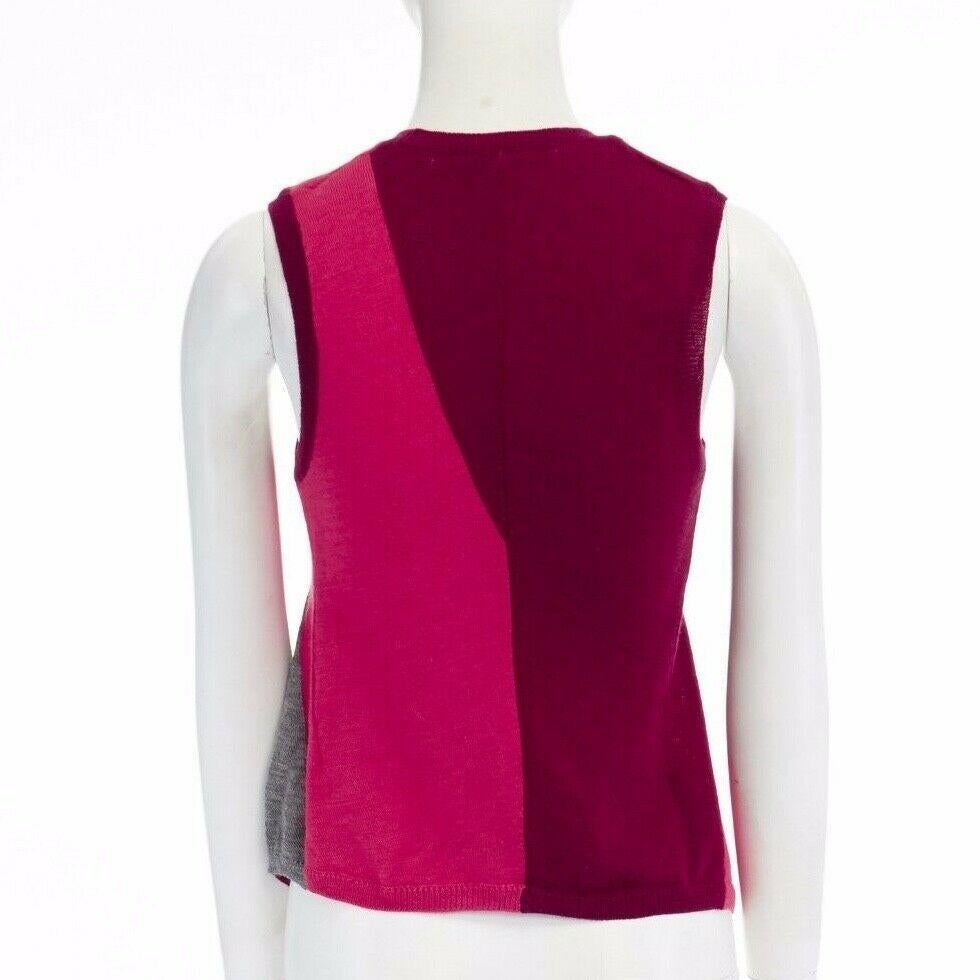COMME DES GARCONS AD1995 pink maroon grey color-blocked draped knitted vest S

COMME DES GARCONS
100% woo. Maroon, pink and grey are color-blocked. Irregular seams and drapes at the front. Ribbed neckline, armhole, and hem. Sleeveless. Curved hem.