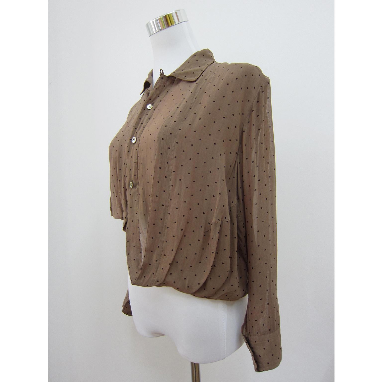 Early Comme des Garcons Tricot draped and folded asymmetric blouse from AD 1989.
Discoloration on the back panel, hardly visible.
Shoulder : 42 cm
Center back length : ca. 45 cm
Sleeve 51 cm
Under arm : 54 cm
