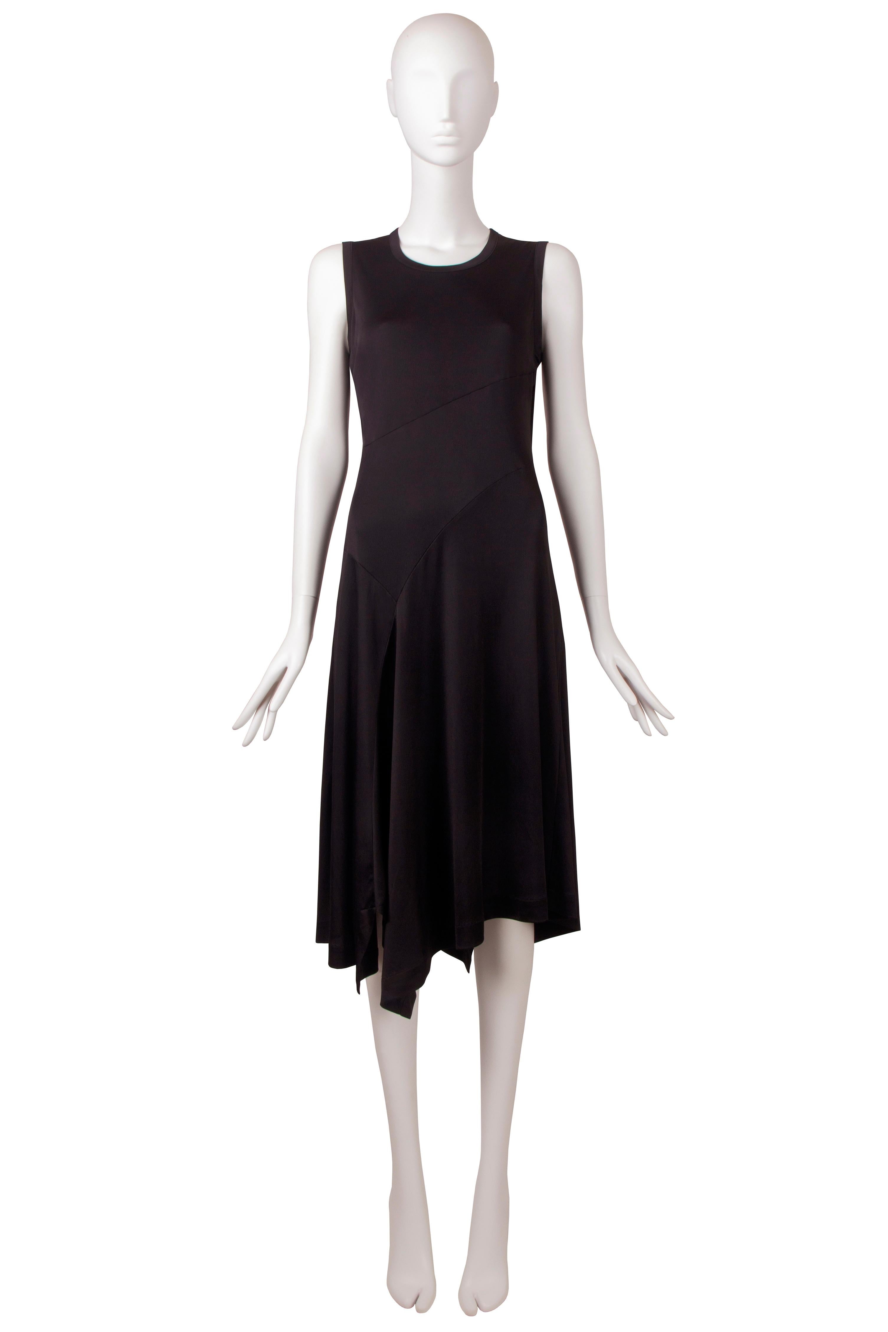 This Comme Des Garcons satin jersey dress from the Fall-Winter 1986 Bias Cutting collection is a great example of the brand’s innovative approach to fashion design. Renowned for their avant-garde aesthetic, Comme Des Garcons has reinterpreted the