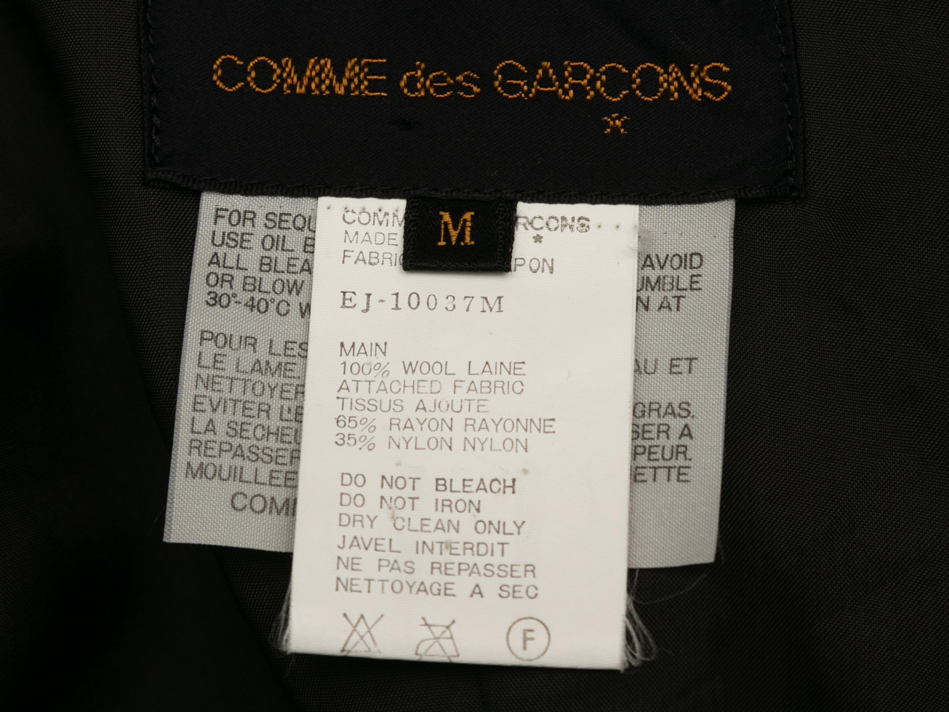 Product details: Vintage black wool beaded bolero jacket by Comme Des Garcons. Notched lapel. Asymmetrical hem. 40
