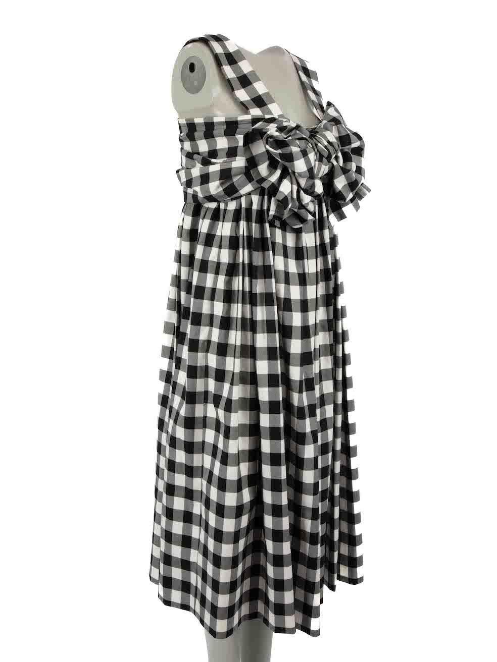 CONDITION is Never worn, with tags. No visible wear to dress is evident on this new Comme Des Garcons designer resale item.
 
Details
Black
Polyester
Dress
Gingham pattern
Sleeveless
Square neck
Bow detail
Midi
Back zip and hook fastening
2x Side