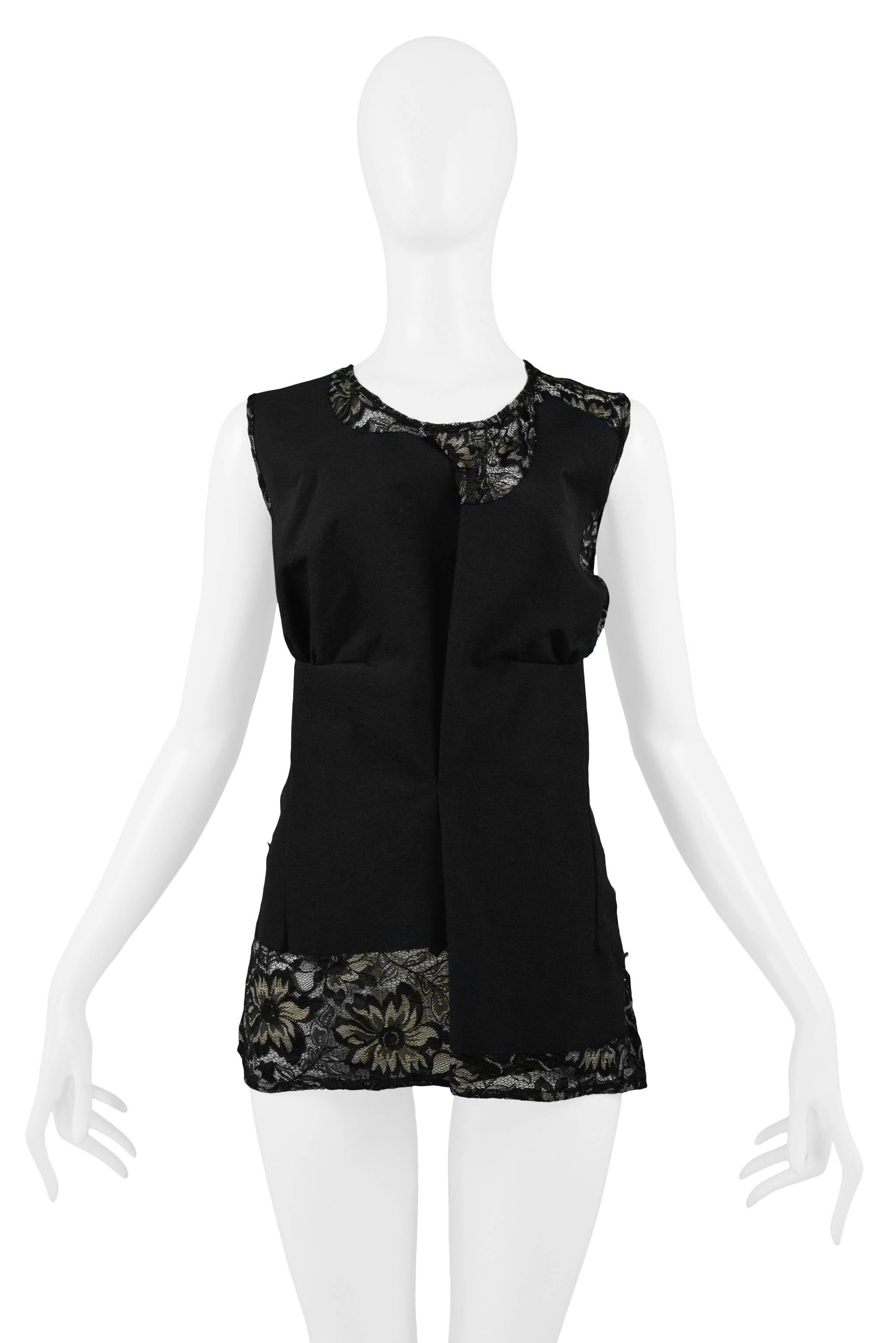 Resurrection Vintage is excited to offer a vintage Comme des Garcons black woven top featuring lace insets, high round neckline, deconstructed bodice, darts, and hip length. From the 1997 collection. 

Comme Des Garcons
Size: Medium
Fabric: Woven &