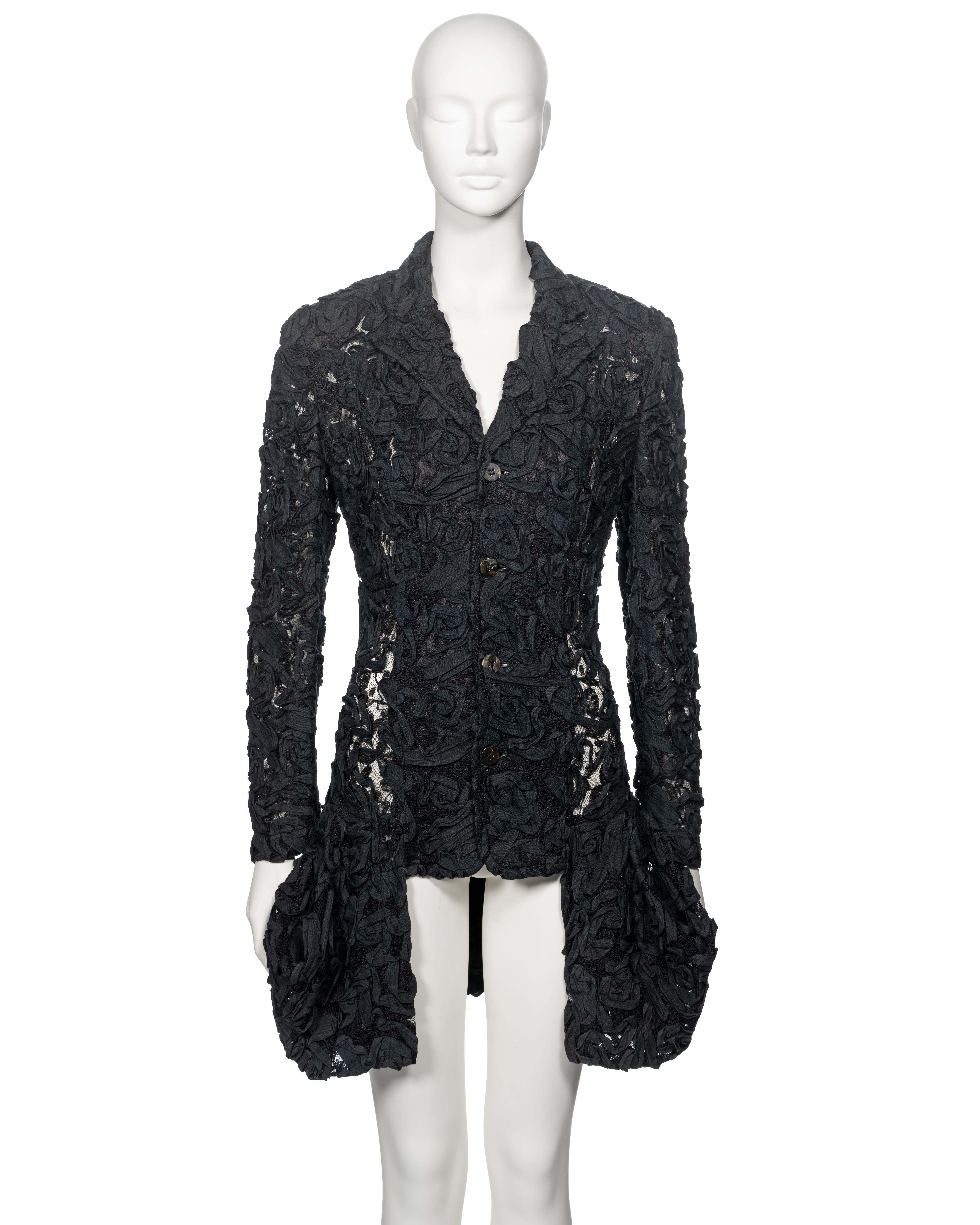 ▪ Archival Comme des Garçons Jacket 
▪ Spring-Summer 1987
▪ Sold by One of a Kind Archive
▪ Constructed from black lace 
▪ Cotton ribbon embroidery 
▪ Single breasted 
▪ Asymmetric bubble hem
▪ Unlined 
▪ Size: Small, please note, the sizing runs