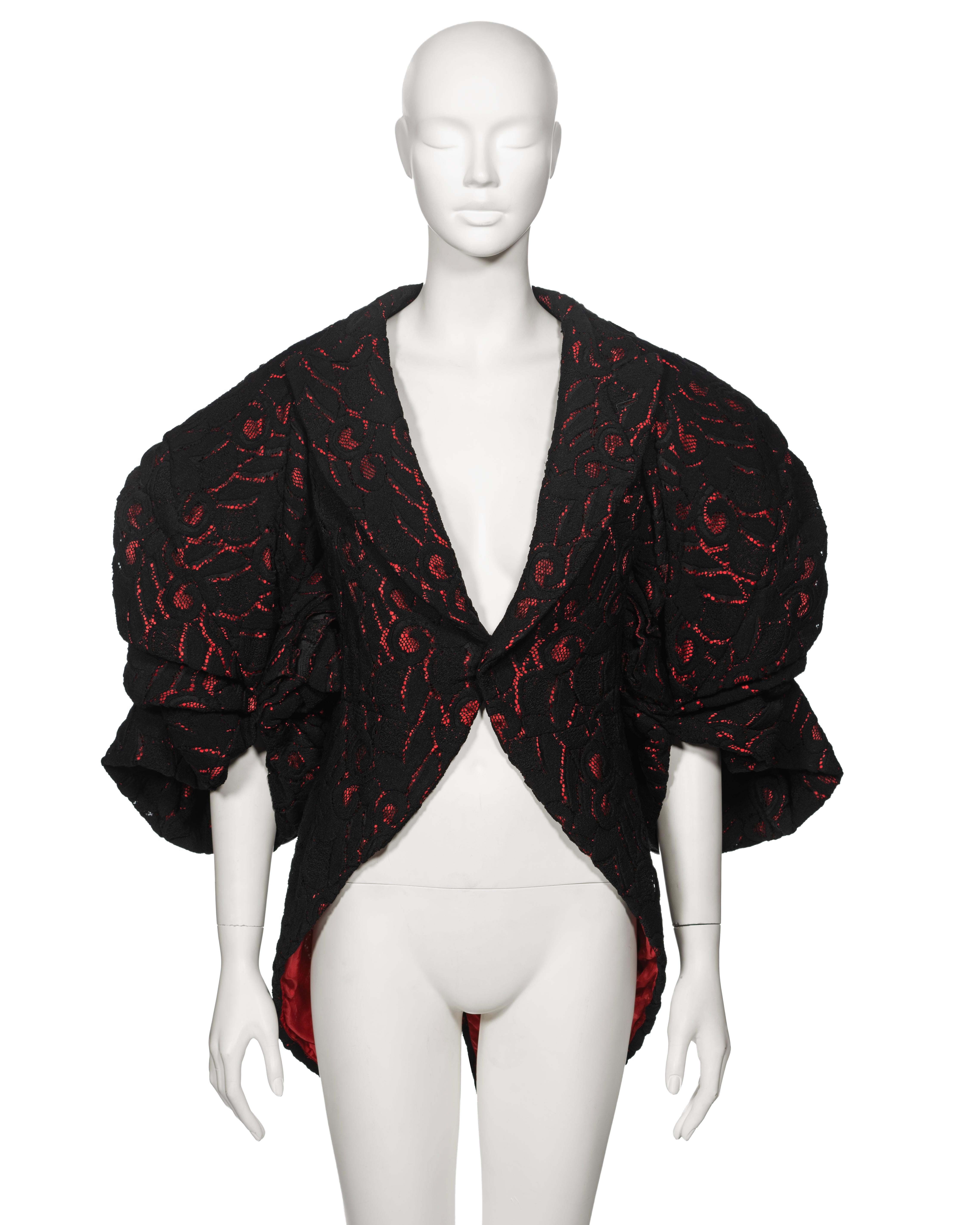 ▪ A Rare Comme des Garçons Runway jacket 
▪ Fall-Winter 2013
▪ Sold by One of a Kind Archive
▪ Fashioned from black cotton lace complemented by a contrasting red lining
▪ Single-breasted silhouette
▪ Features wide peak lapels
▪ Tailcoat-style
