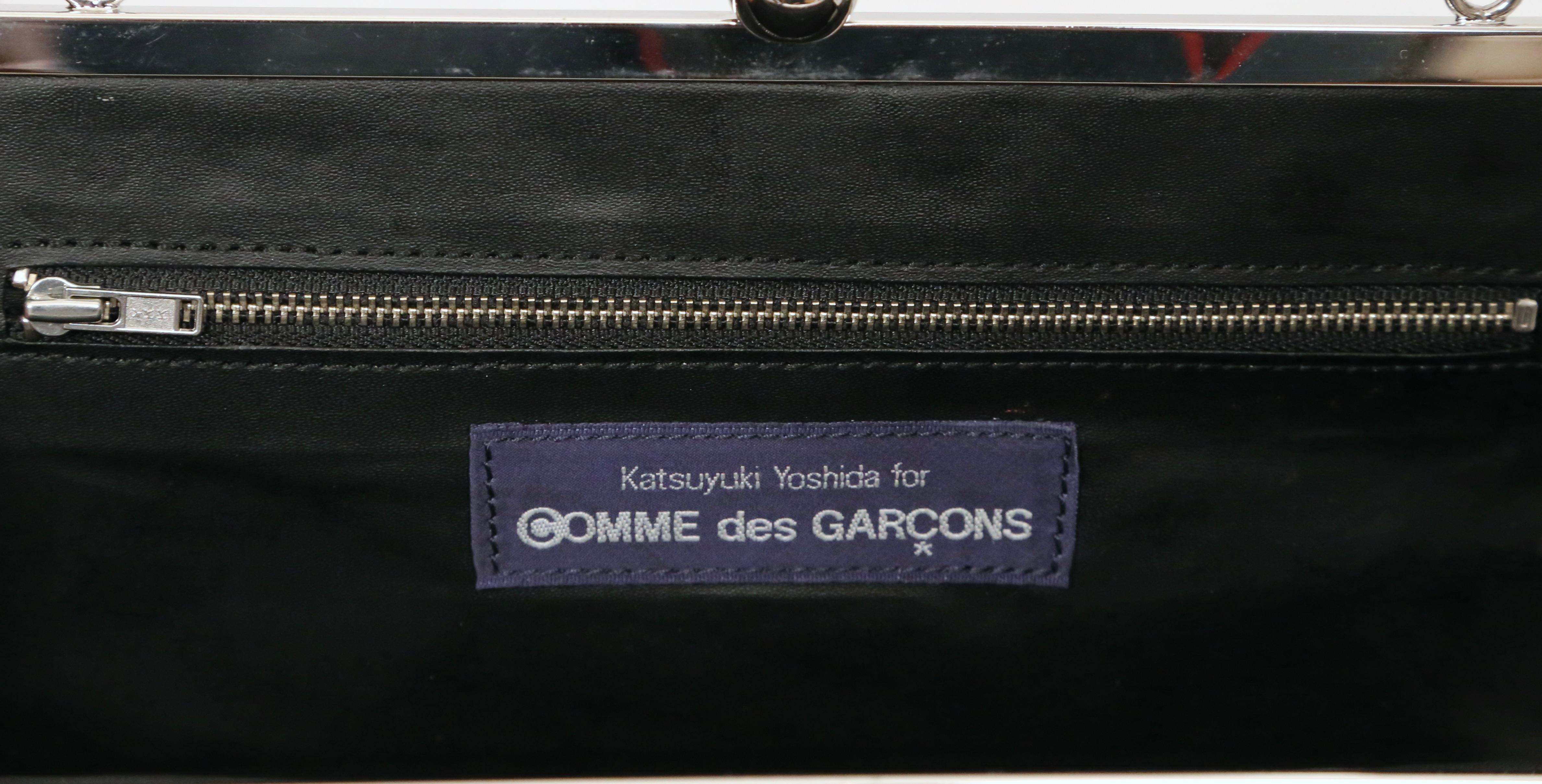 Women's or Men's COMME DES GARCONS black leather cross body bag with silver 'kiss lock' frame