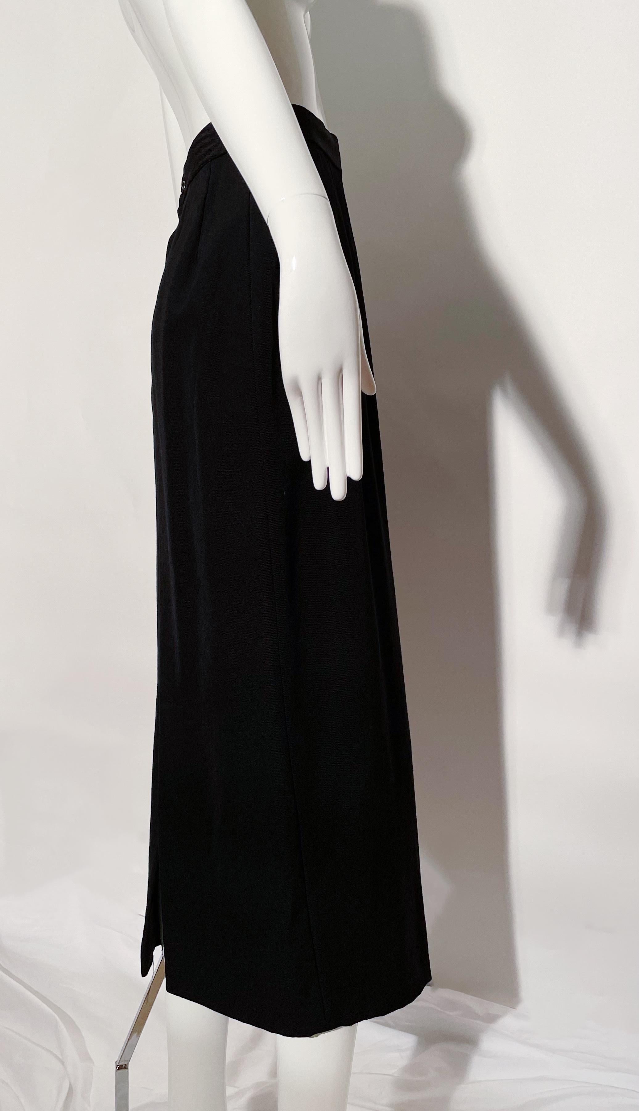 Black maxi skirt. Rear slit. Lined. Wool. Made in Japan. 
*Condition: Excellent vintage condition. No visible flaws.

Measurements Taken Laying Flat (inches)—
Waist: 25 in.
Hip: 34 in.
Length:  36 in.
Marked size: S