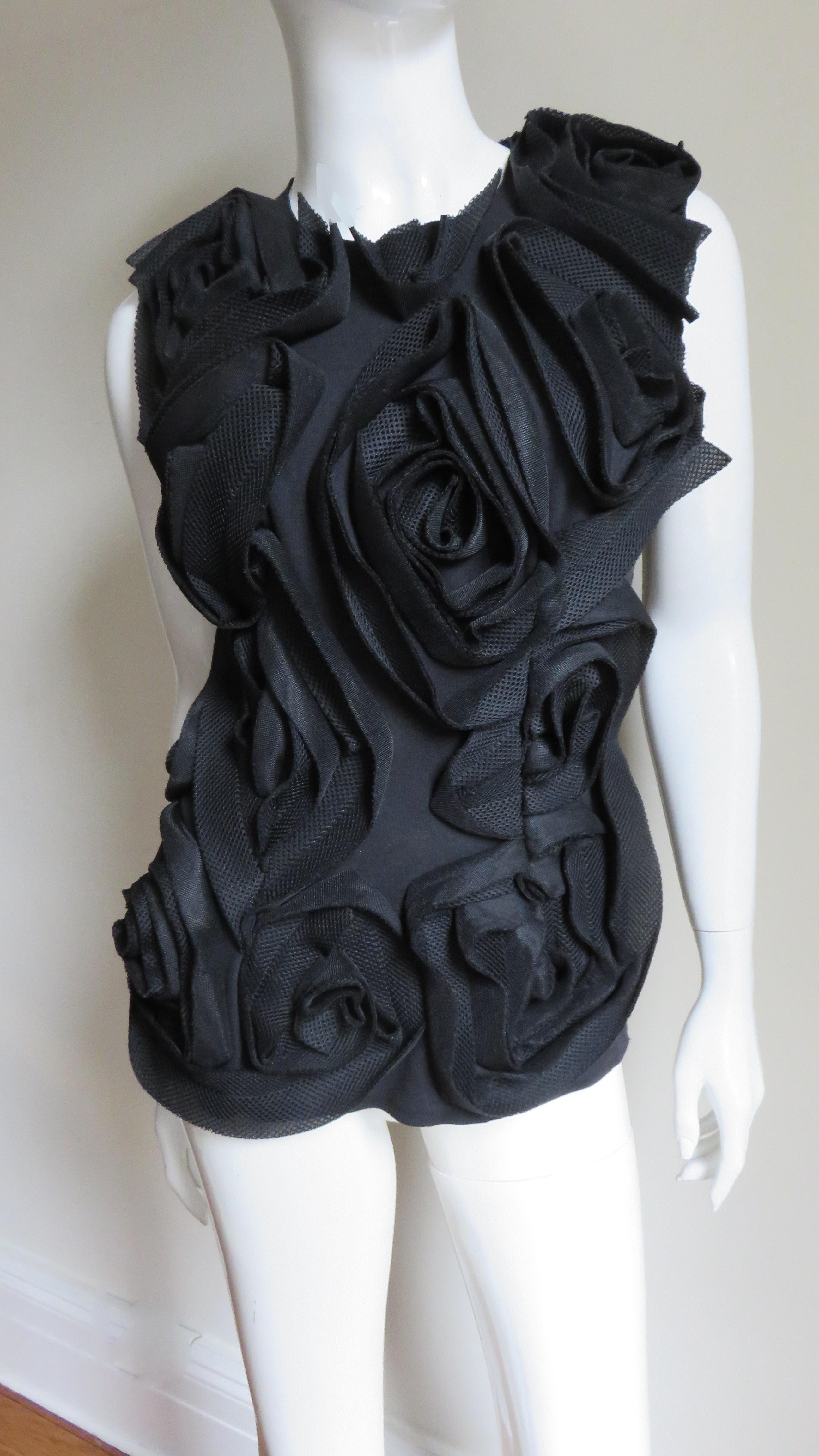 A fabulous sleeveless black jersey top, the front covered in applique black roses from Comme des Garcons, CDG.  It has a silver side zipper.  
Fits sizes Small, Medium.  Marked size S.

Bust  36-38