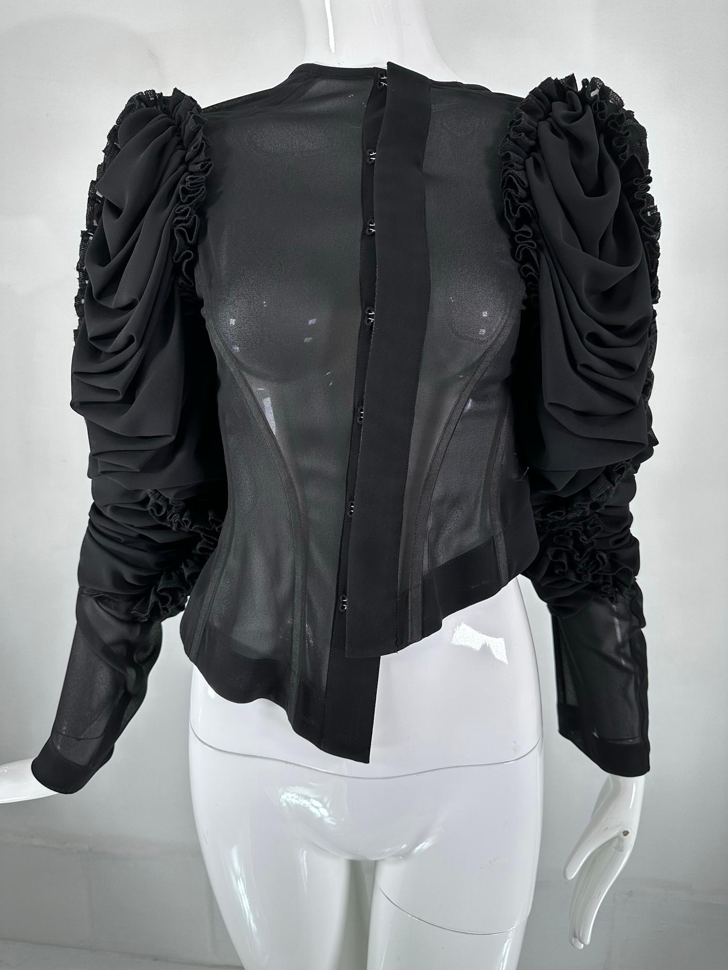 Comme Des Garcons black sheer polyester chiffon, draped balloon Sleeve top 2004. Asymmetrical hem bodice has off white taped seams, the top closes with hook & eyes the facings are taped in off white. There are over sleeves which are very full &