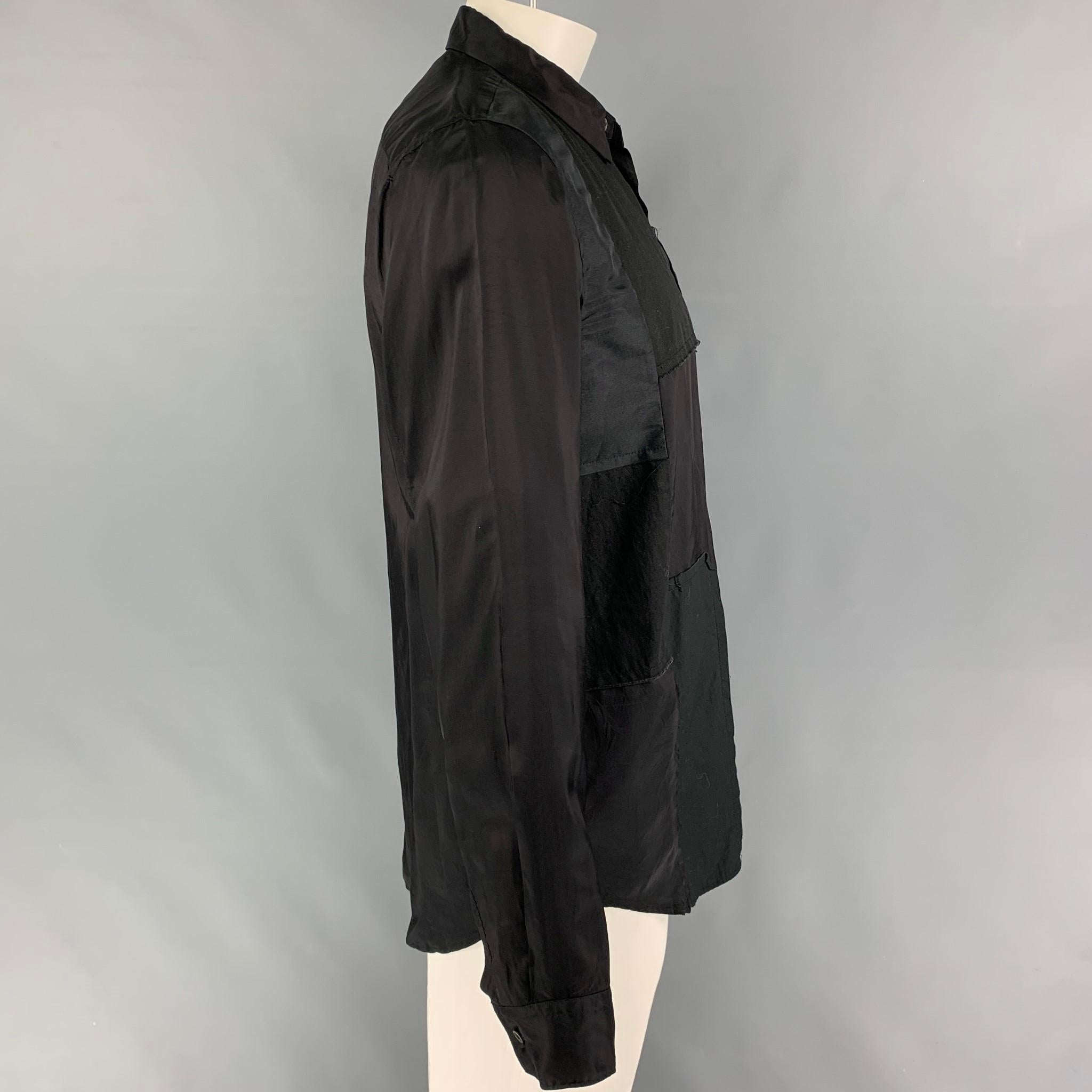 COMME des GARCONS BLACK long sleeve shirt comes in a black cotton / cupro featuring a patch work design, spread collar, and a button up closure. Made in Japan. 

Very Good Pre-Owned Condition.
Marked: XL / AD2018

Measurements:

Shoulder: 18