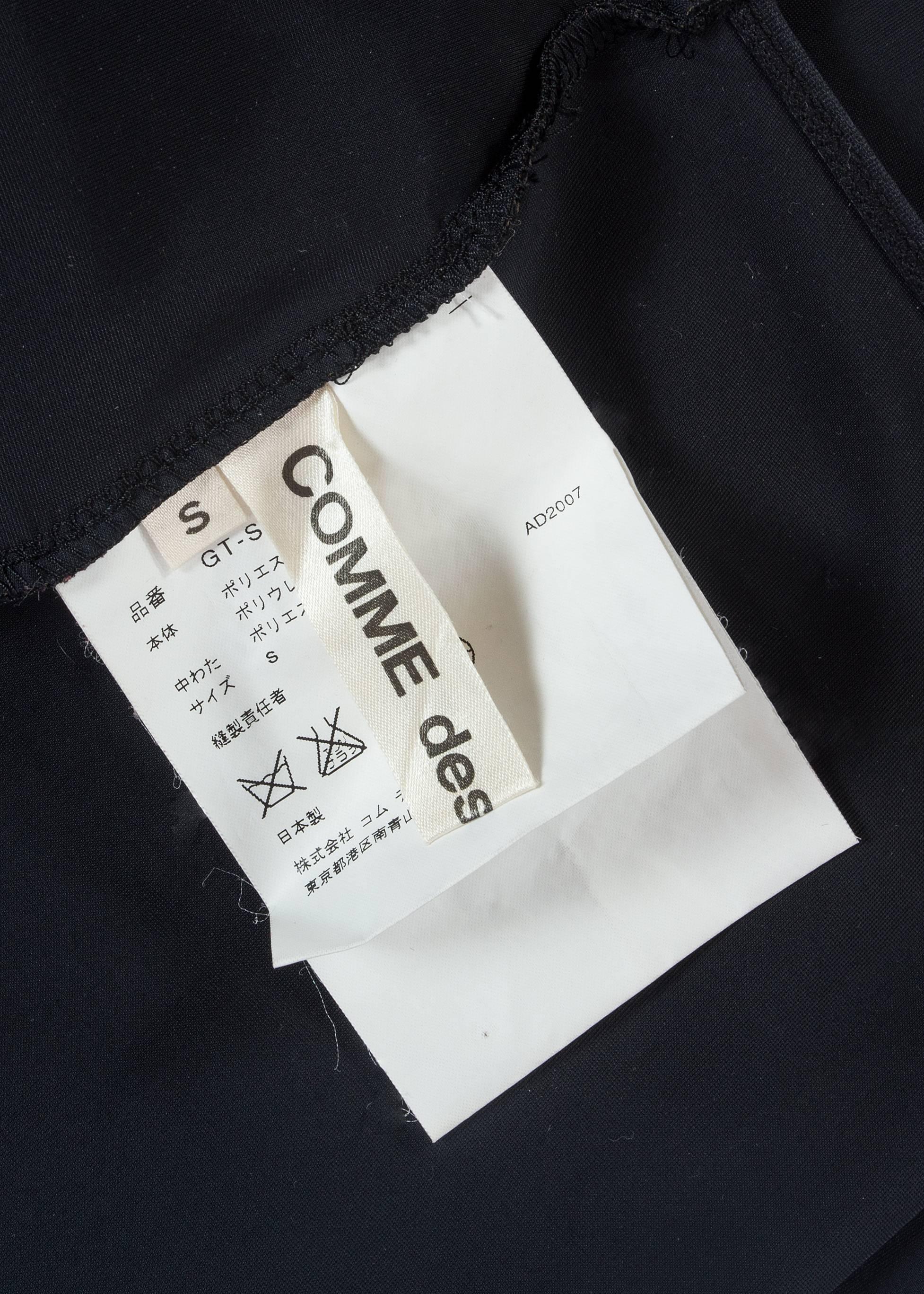 Black Comme des Garcons black spandex pencil skirt with embossed gloves, aw 2007