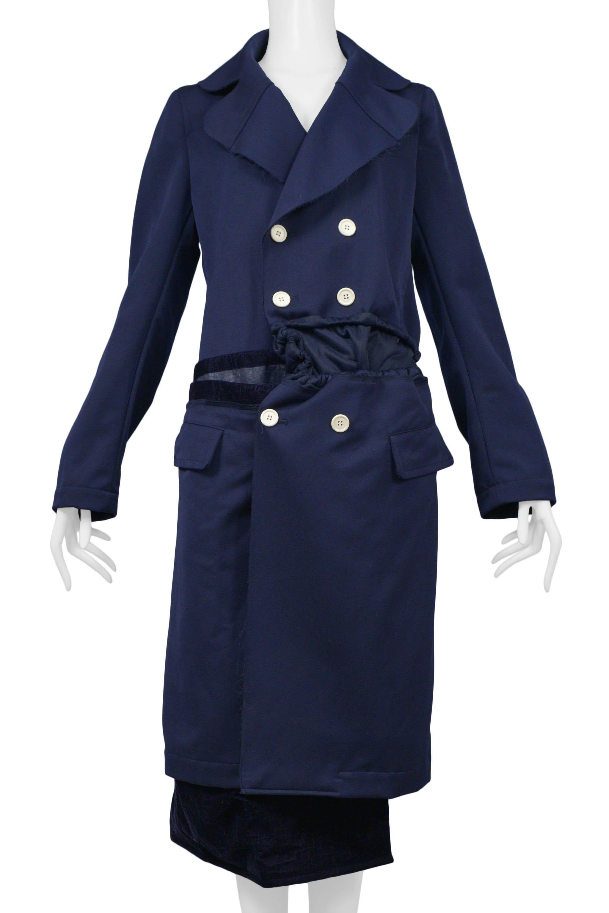 Resurrection Vintage is excited to offer a vintage Comme des Garcons blue coat featuring a double-breasted front with white buttons, wide lapels, drawstrings, and velvet insets and trim.

Comme Des Garcons
Size: Medium 
Fabric: 100% Polyester
2008