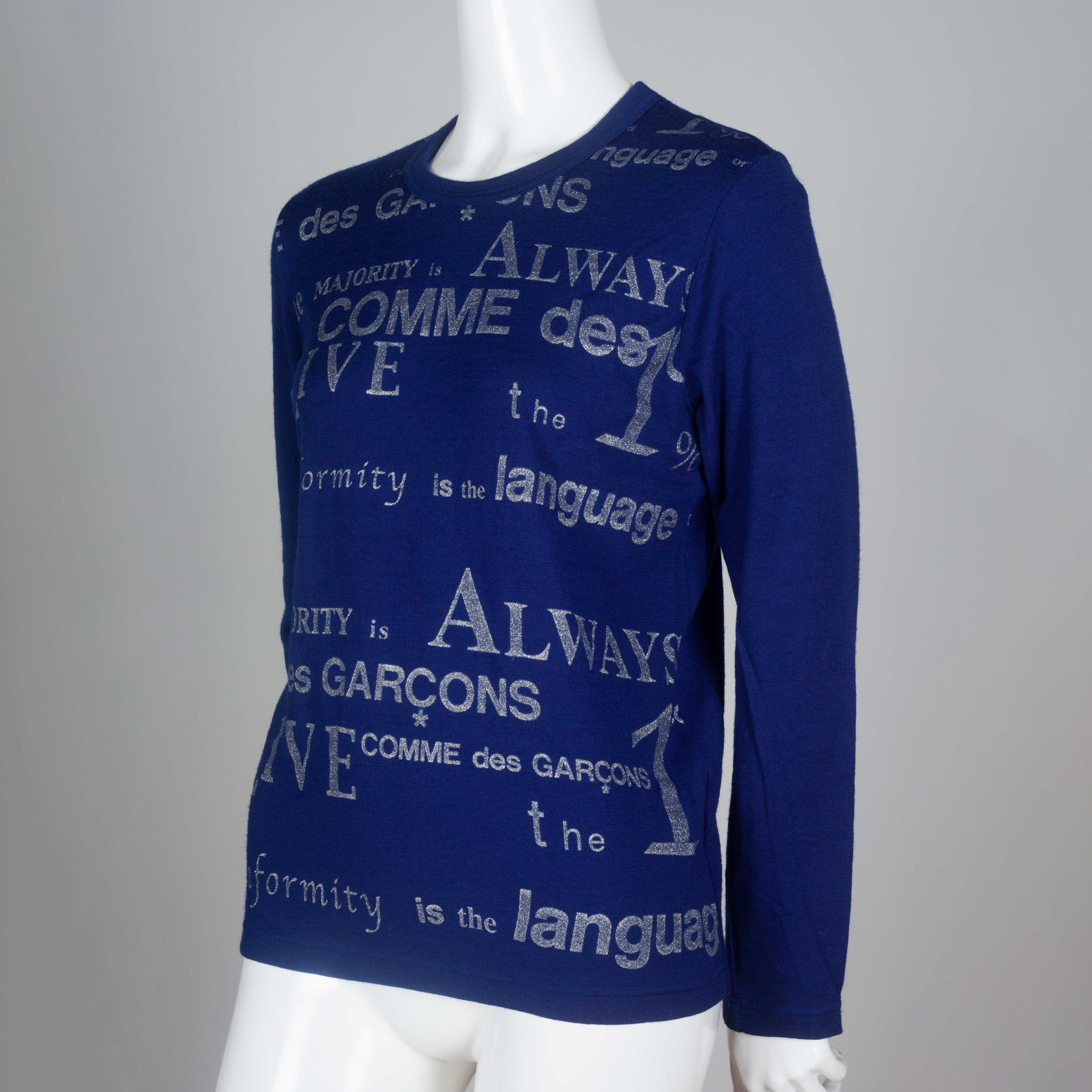 Comme des Garçons 2003 long sleeve wool shirt from Japan in blue with silver screen printed words.

YEAR: 2003
MARKED SIZE: No size marked
US WOMEN'S: S
US MEN'S: XS
FIT: Regular
CHEST: 17
