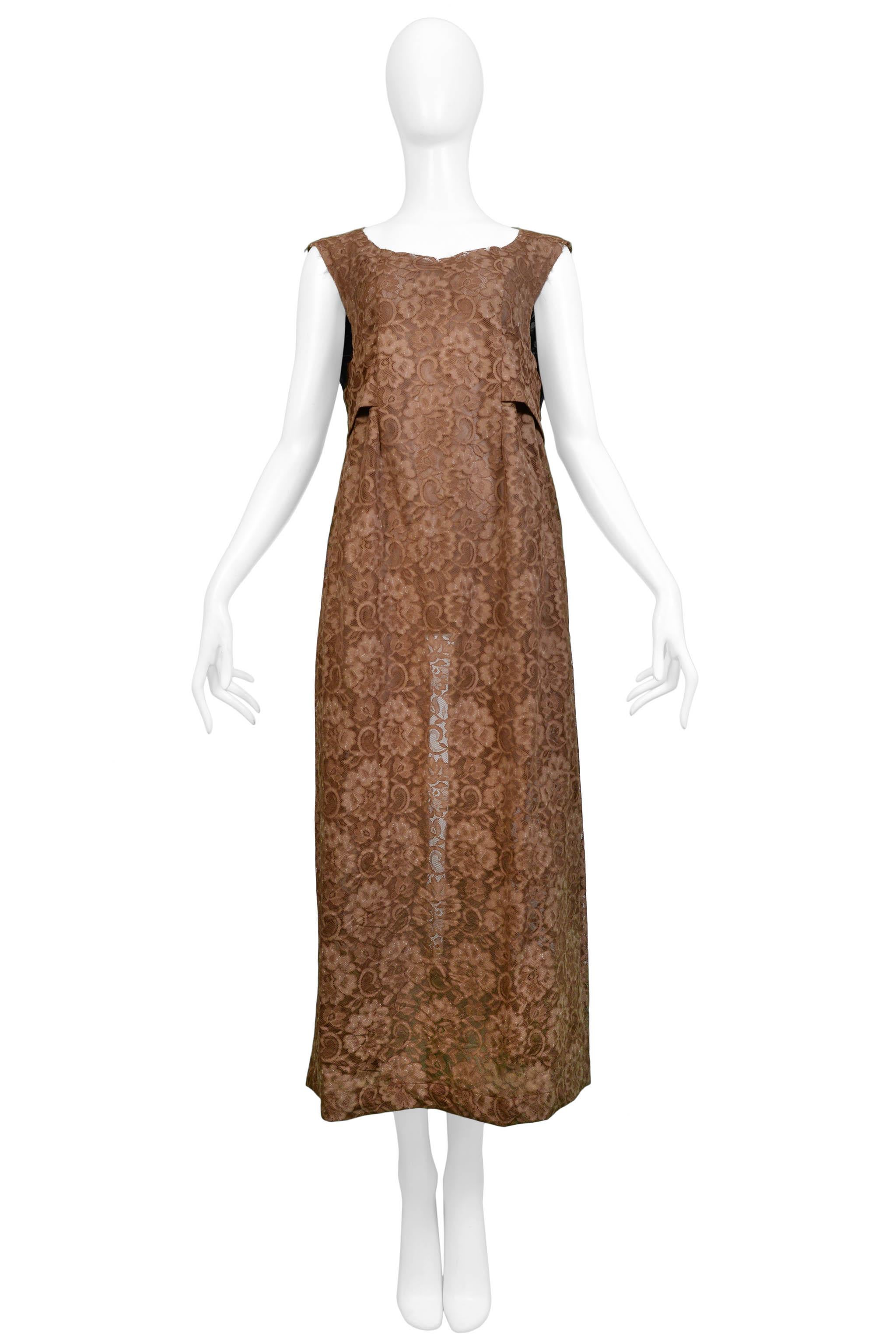 Resurrection Vintage is excited to offer a vintage Comme des Garcons brown lace apron dress featuring an attached belt and open back. 

Comme Des Garcons
One Size
Lace
Excellent Vintage Condition  