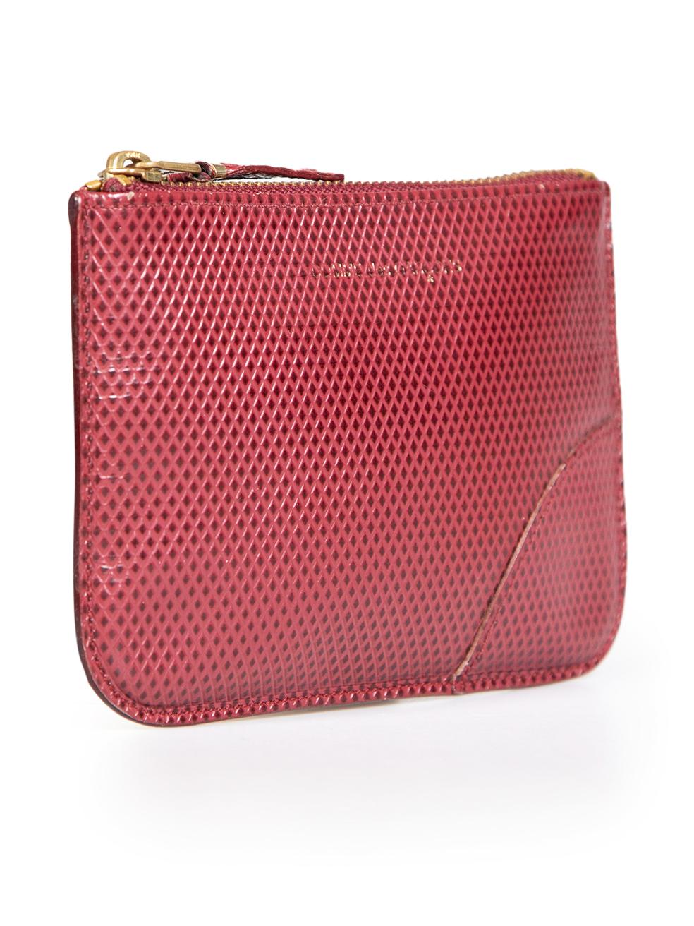 CONDITION is Good. General wear to Card holder is evident. The zipper is tarnished. Brand writing is faded on the front panel but still readable on this used Comme Des Garcons designer resale item.
 
 Details
 Red
 Leather
 Pouch
 Diamond embossed