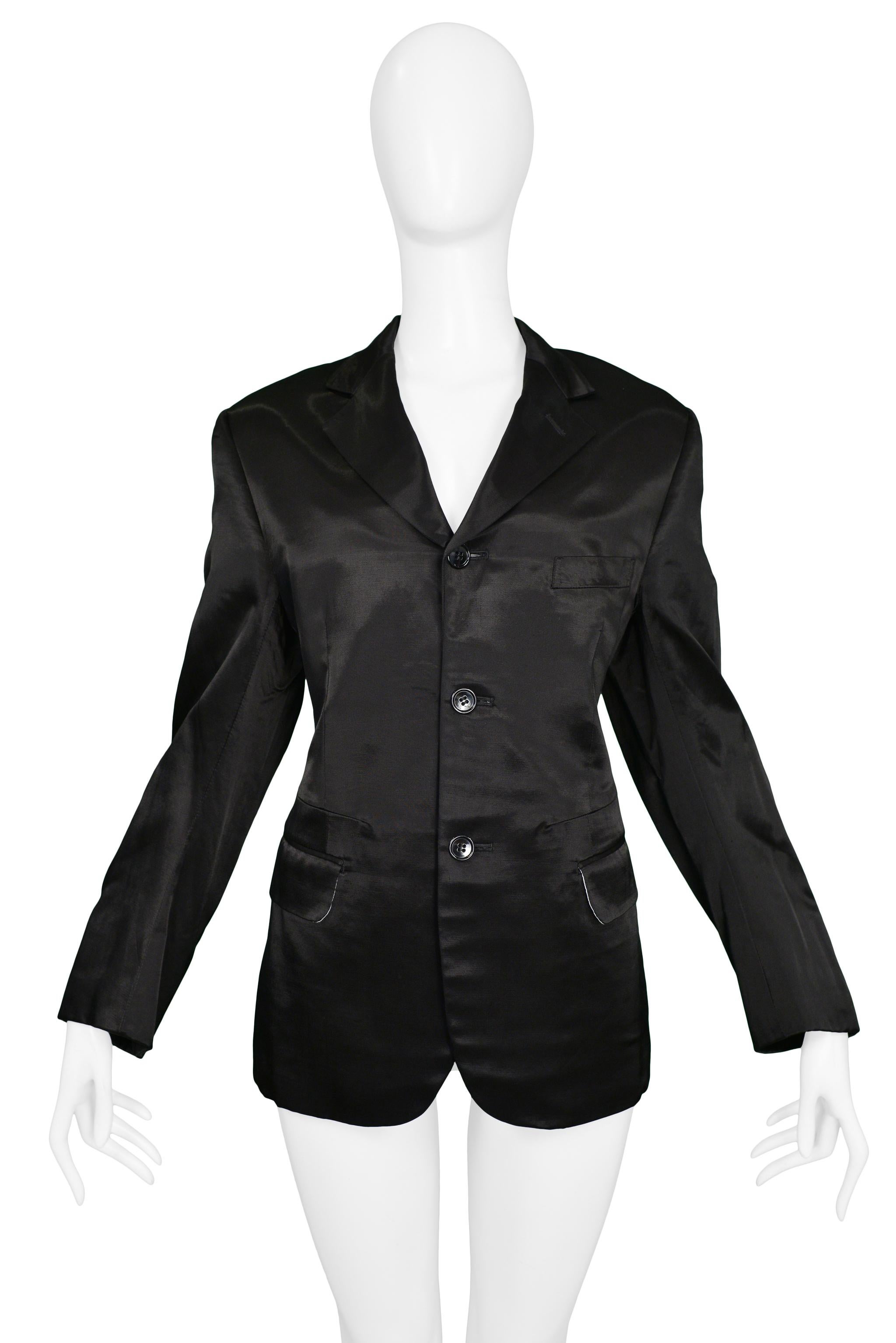 Resurrection Vintage is excited to offer a vintage Comme des Garcons black satin blazer with a three-button front enclosure, side pockets, and hip length.

Comme Des Garcons
Size: Small
Fabric: Satin
Very Good Vintage Condition 
Authenticity