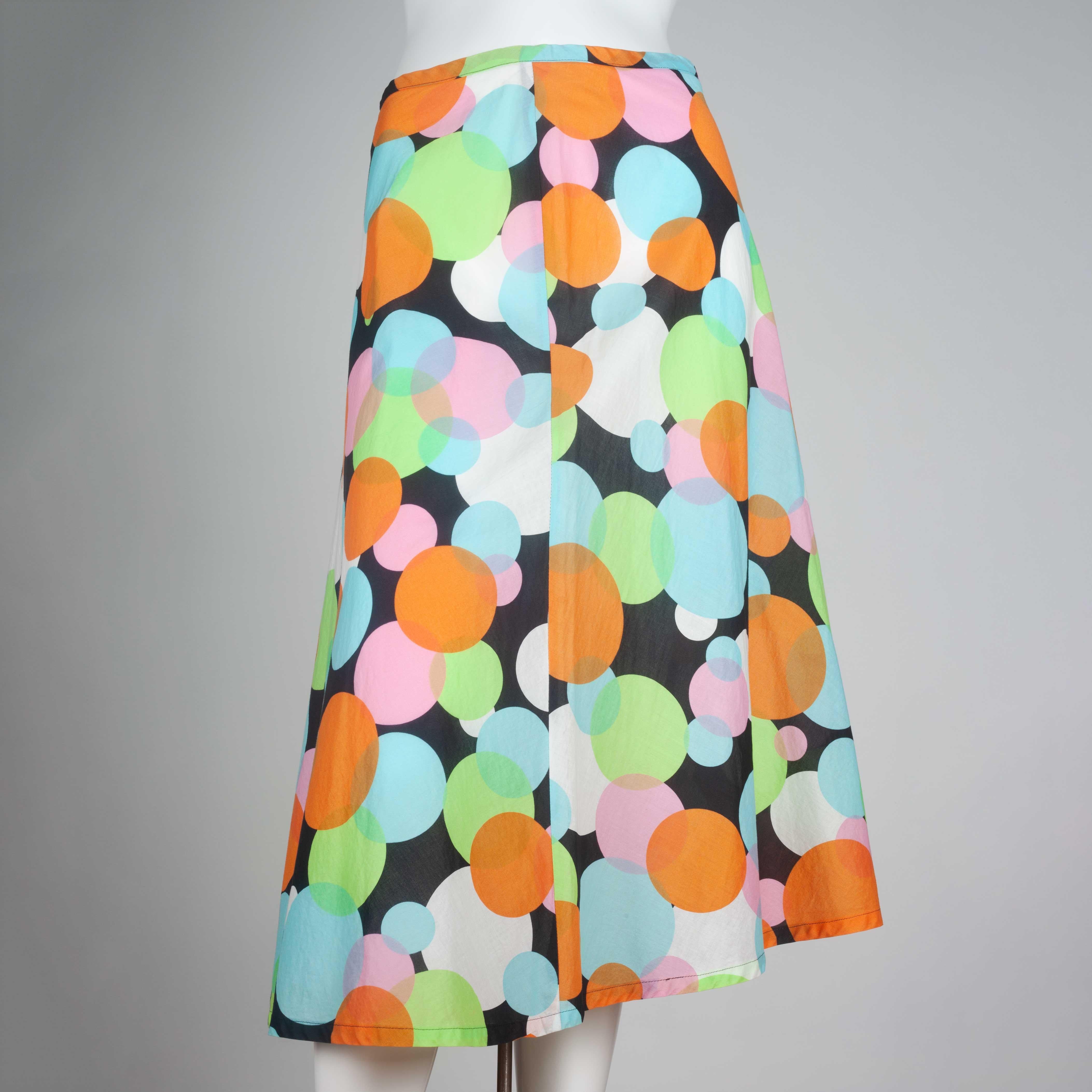Comme des Garçons 2003 archive, a cotton skirt from Japan with large dots in orange, blue, green, pink and white on a black background. Delicate, thin cotton material. Yayoi Kusama feels.

YEAR: 2003
MARKED SIZE: No size marked
US WOMEN'S: S
US