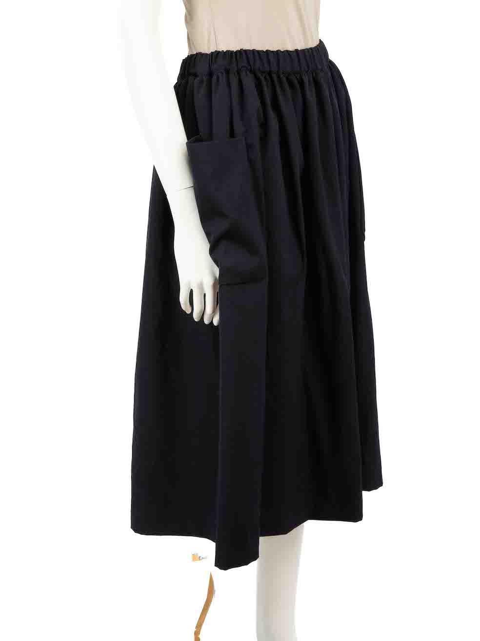CONDITION is Very good. Hardly any visible wear to skirt is evident on this used Comme Des Garcons Girl designer resale item.
 
 Details
 Navy
 Wool
 Full skirt
 Midi length
 Elasticated waistband
 2x Front side pockets
 
 
 Made in Japan
 
