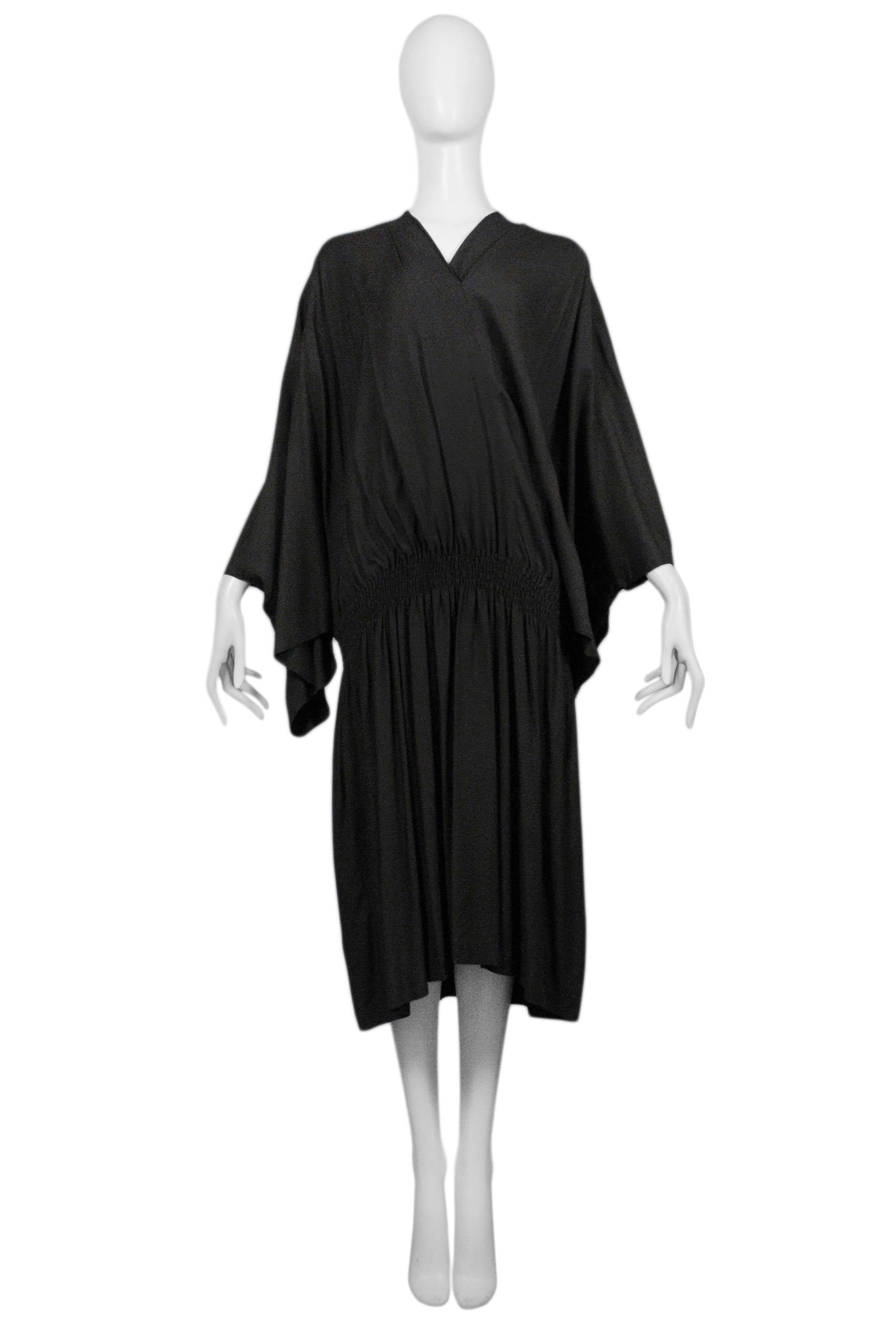 Resurrection Vintage is excited to offer a vintage Comme des Garcons dark brown kimono dress with drop-waist, high v neck, and butterfly sleeves. Collection 1982.

Comme Des Garcons
Size: Small/Medium
Measurements: Bust Free, Waist (unstretched)