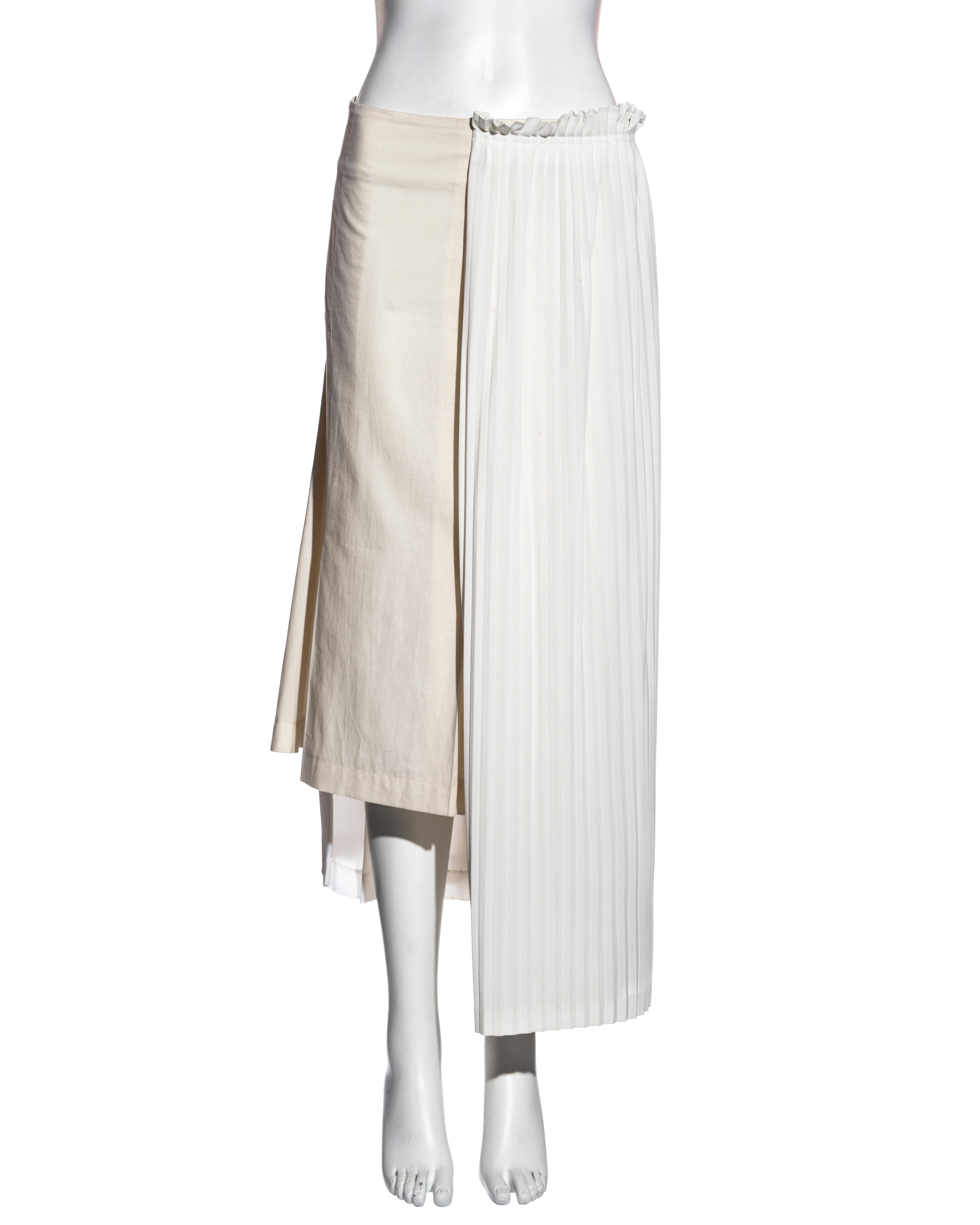 ▪ Comme des Garçons deconstructed cream skirt 
▪ Constructed out of three pleated skirts
▪ Irregular hemline 
▪ Size Medium
▪ Spring-Summer 2002
▪ Made in Japan
