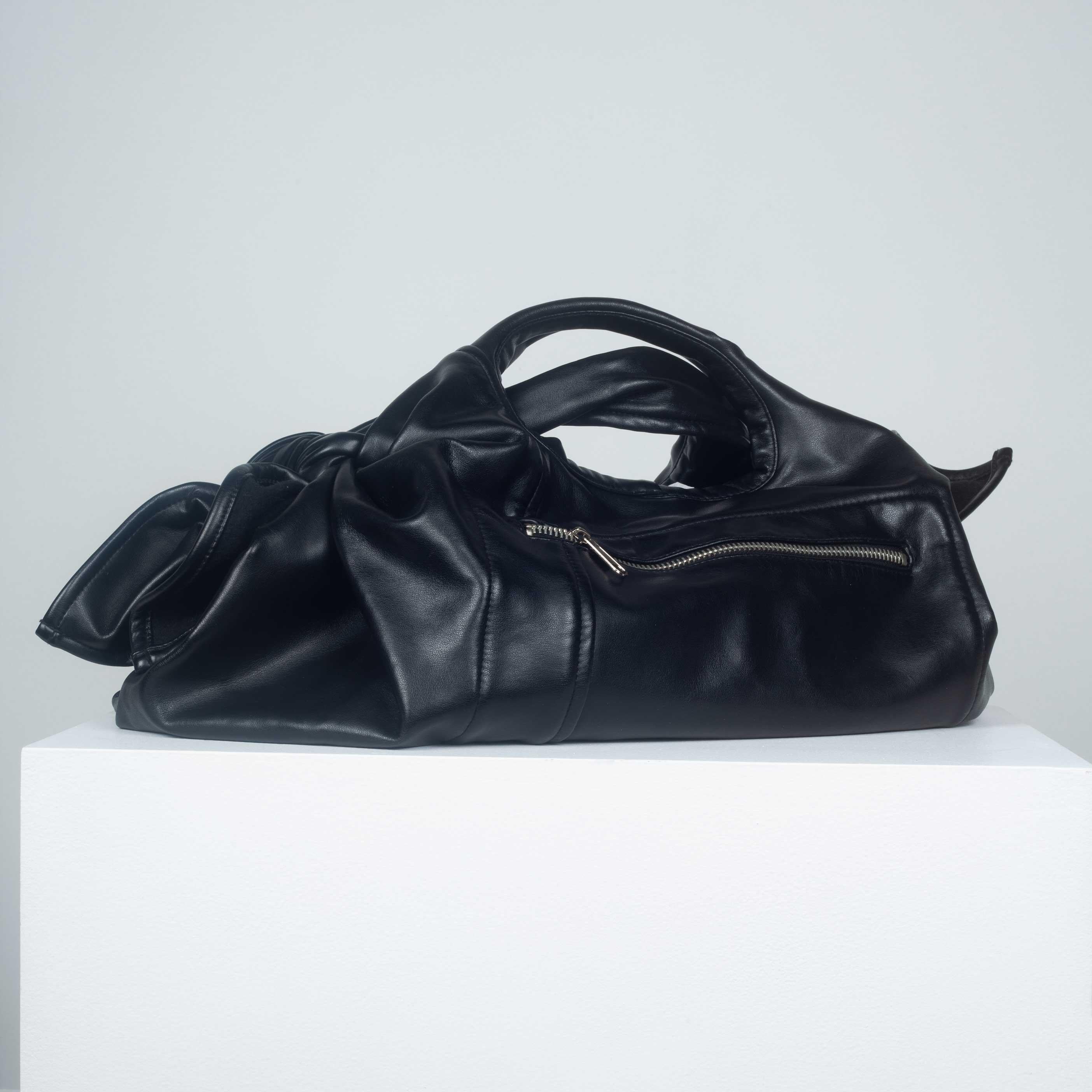 Comme des Garçons black purse from Japan in soft synthetic leather with soft black felt-like lining.
  
YEAR: Unknown
MARKED SIZE: No size marked
FIT: Regular
WIDTH: 8