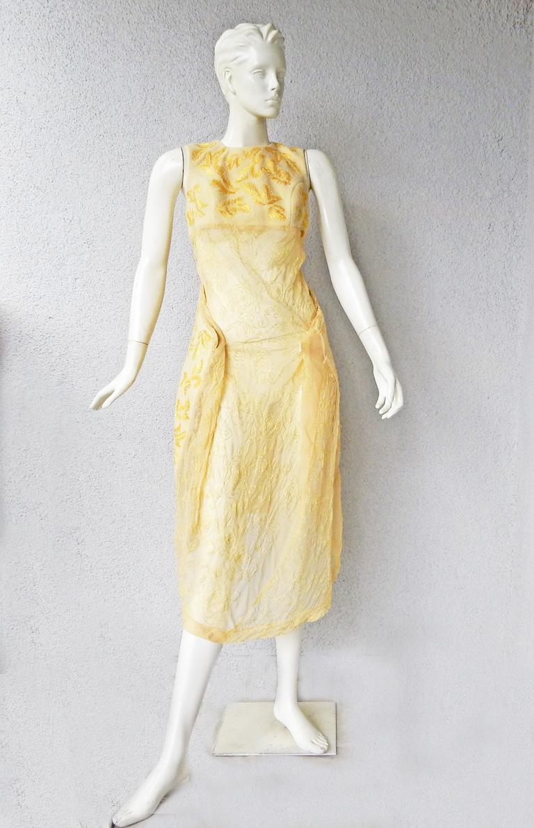 1997 A/W Comme des Garcons sculptural shape of folded wings in an intersting fabrication. As seen on the runway.  Fashioned of wool and poly in a soft shade of yellow with gold leaf embroidery.  Sleeveless fitted bodice extending into a sheer