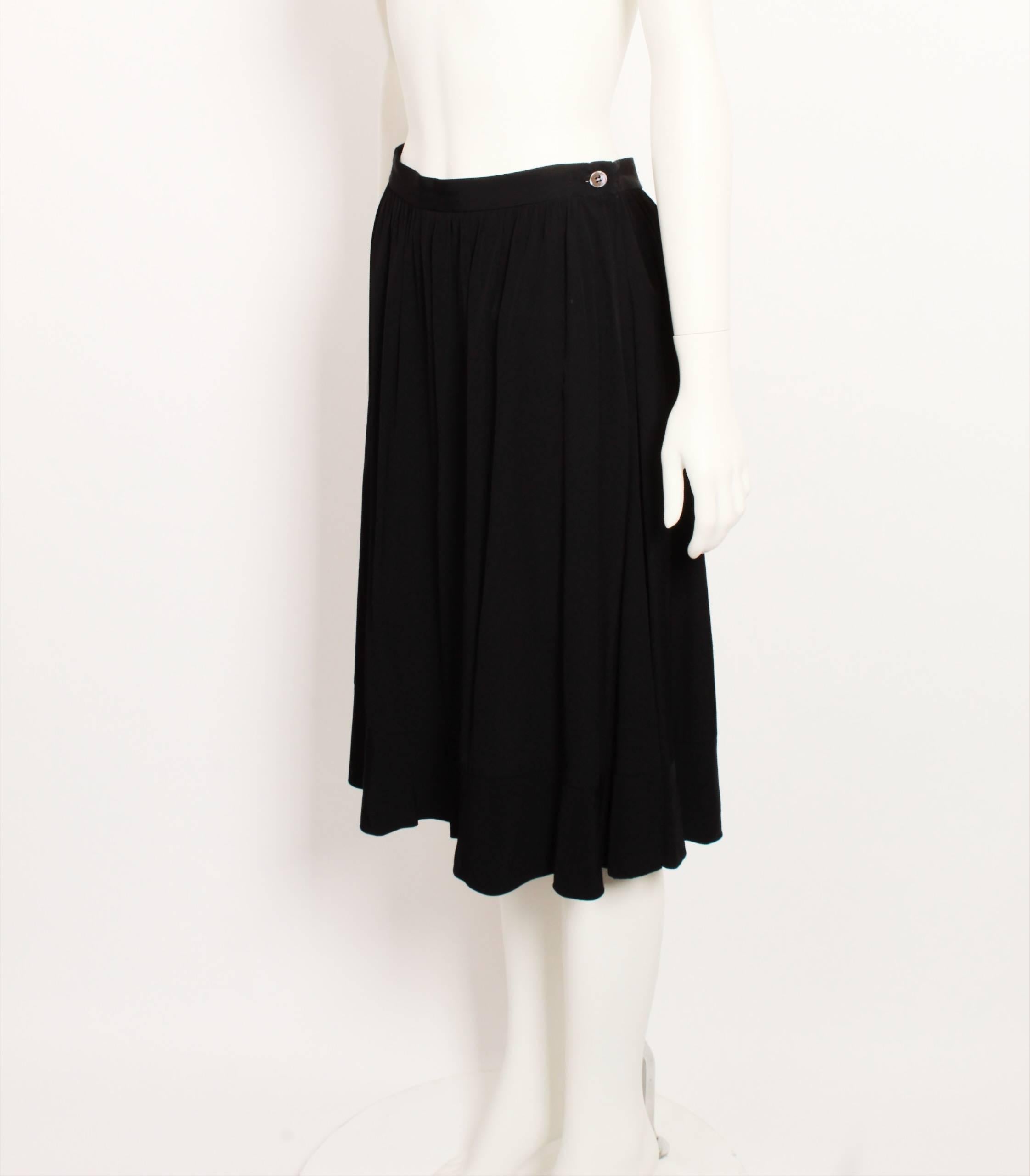 Comme des Garcons black  A-line skirt with hem frill. 
Made in Italy. Size M.