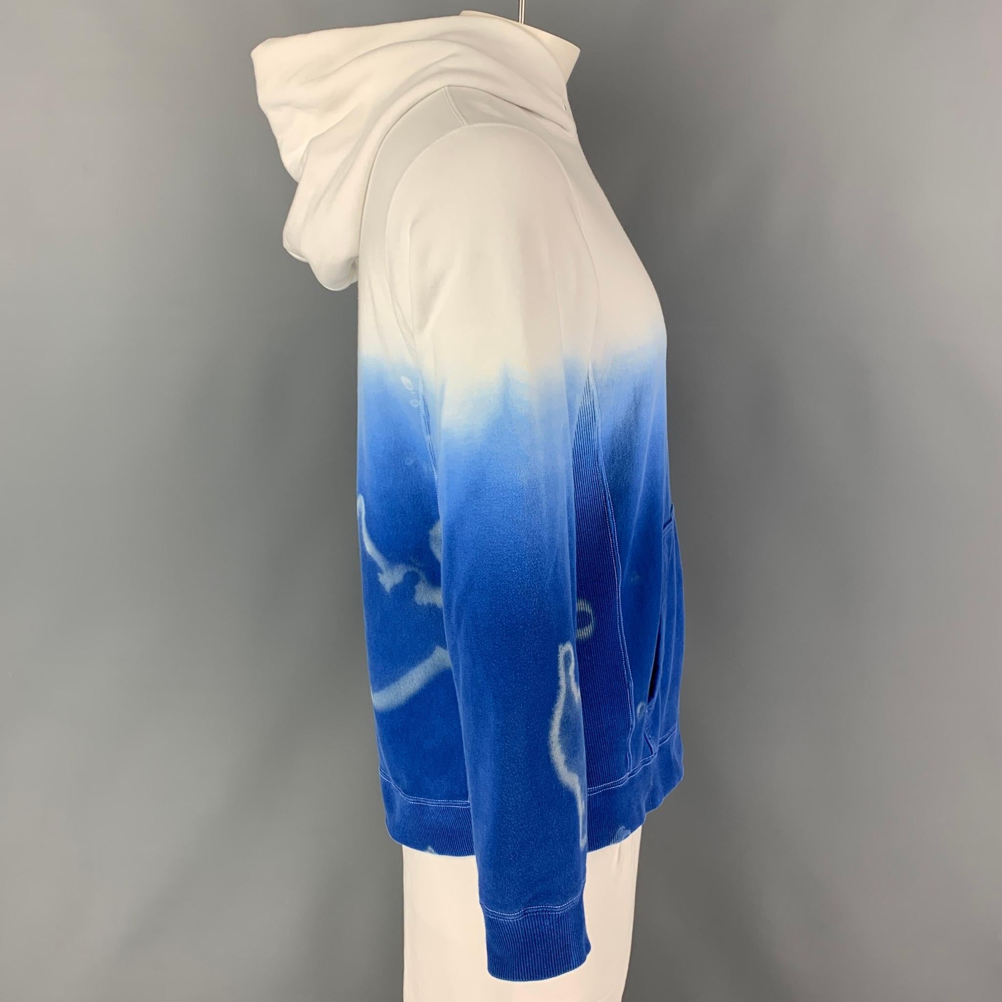 COMME des GARCONS GANRYU sweatshirt comes in a blue & white ombre cotton featuring a hooded style, ribbed side panels, contrast stitching, and a front pouch pocket. Made in Japan. Custom made by local artist Adam Brit. 

Excellent Pre-Owned